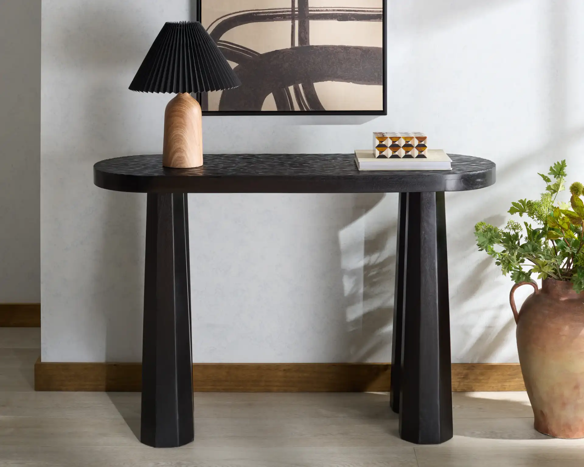 Petraclara Wood Console Table in Black in a styled room