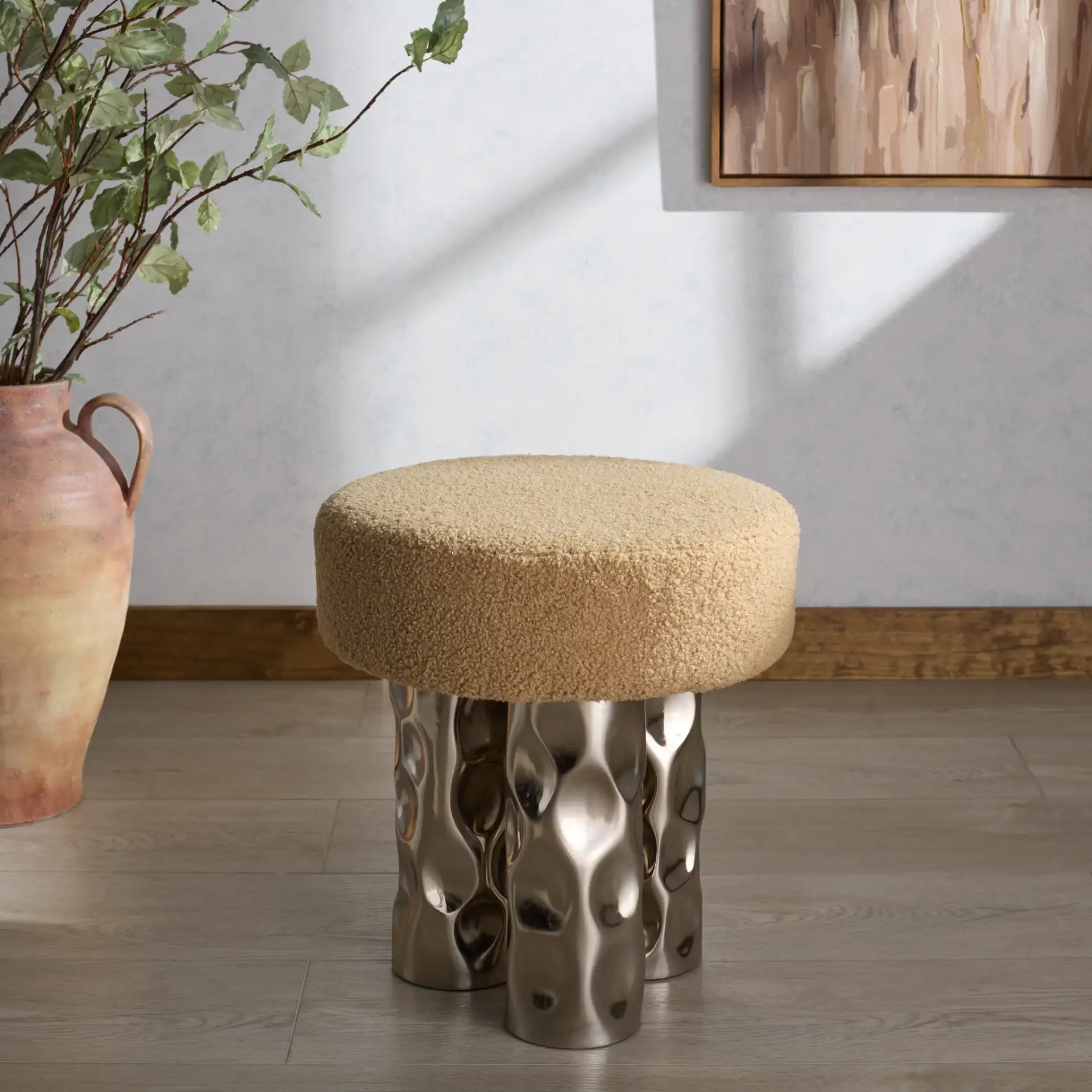 Aubrie Teddy Fabric Ottoman in Beige / Silver in a styled room