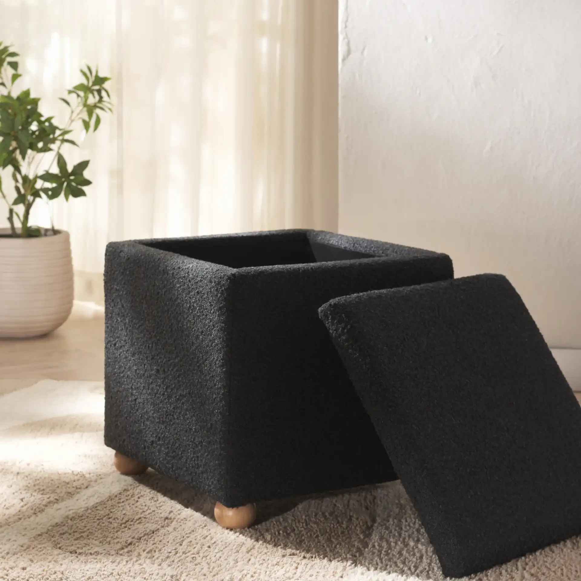 Becka Square Boucle Storage Ottoman in Black / Natural in a styled room