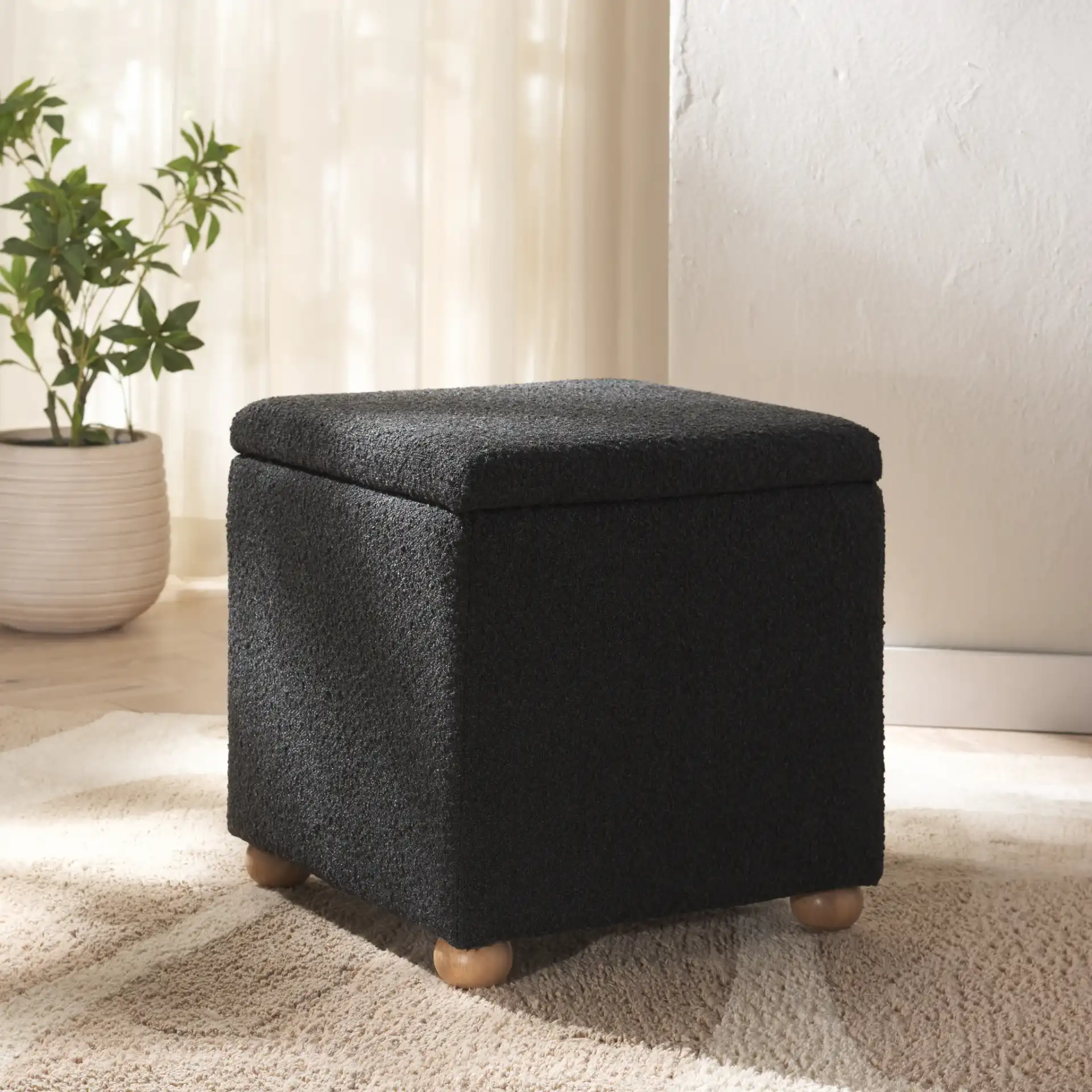 Becka Square Boucle Storage Ottoman in Black / Natural in a styled room