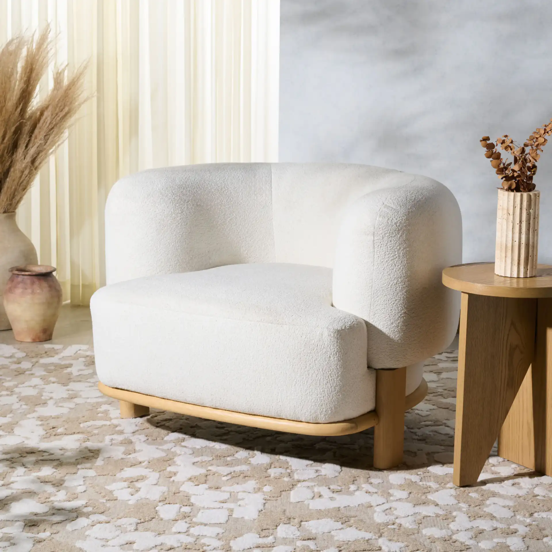 Oscar Boucle Accent Chair in Light Brown / Natural in a styled room