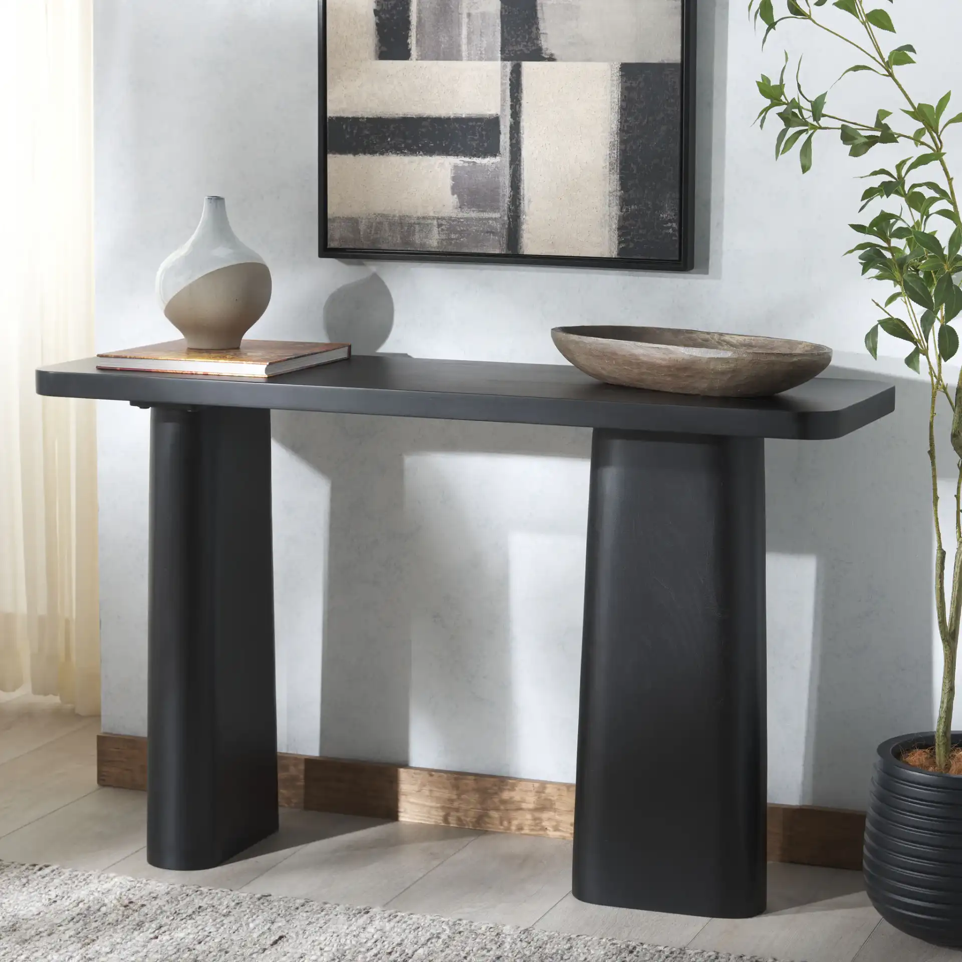 Martinelli Wood Console Table in Black in a styled room