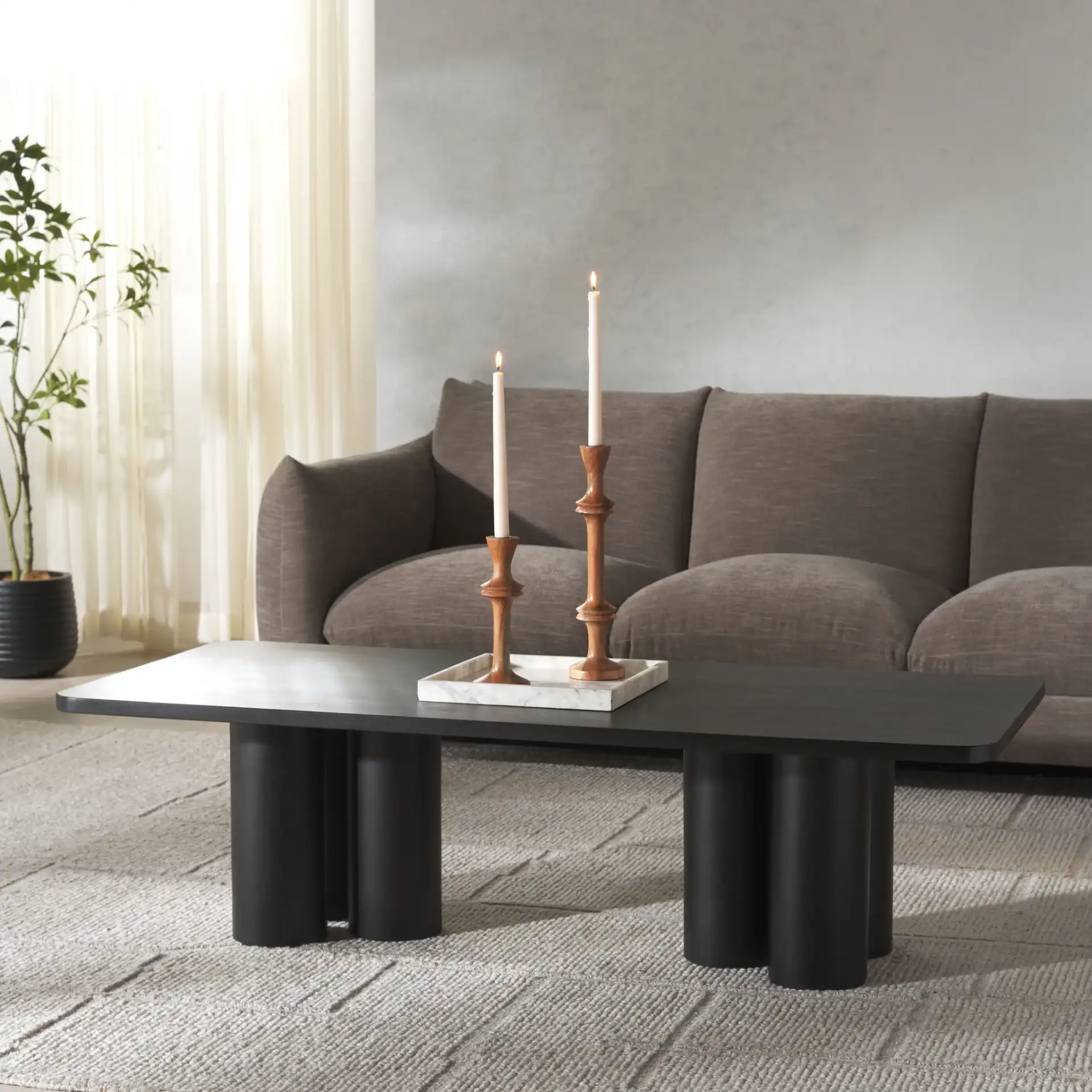 Kathalina Wood Coffee Table in Black in a styled room