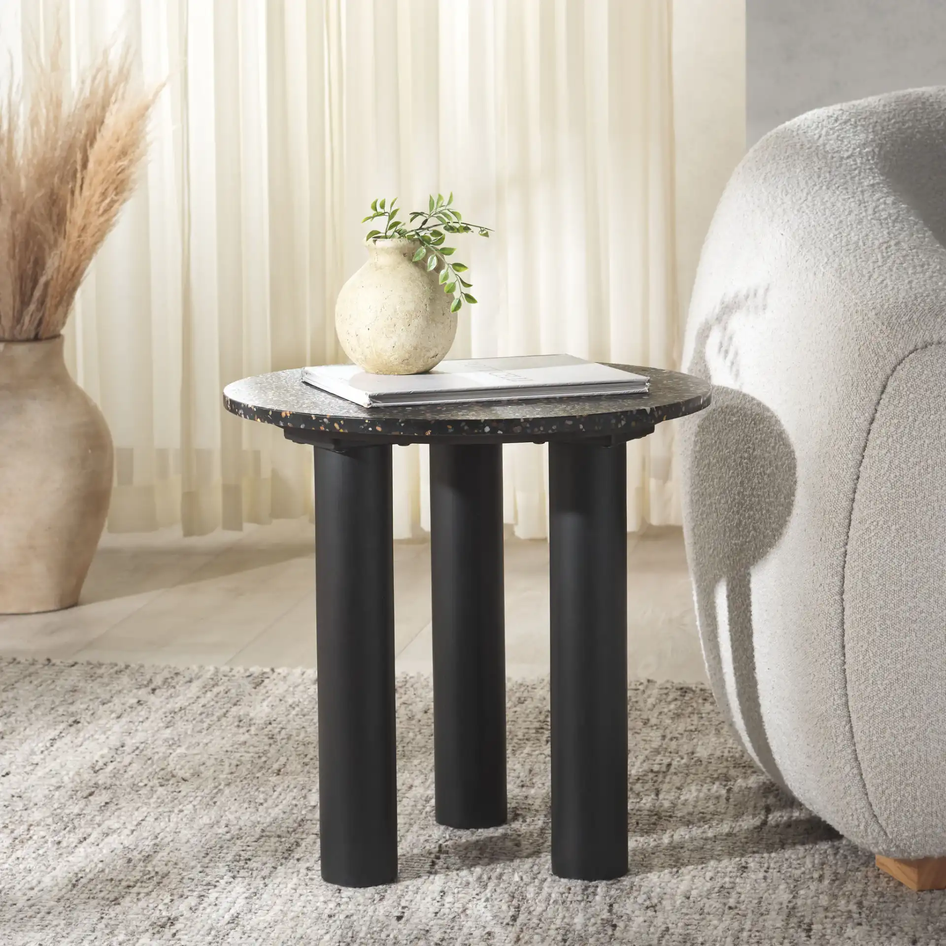 Kathalina Terrazzo Accent Table in Black in a styled room