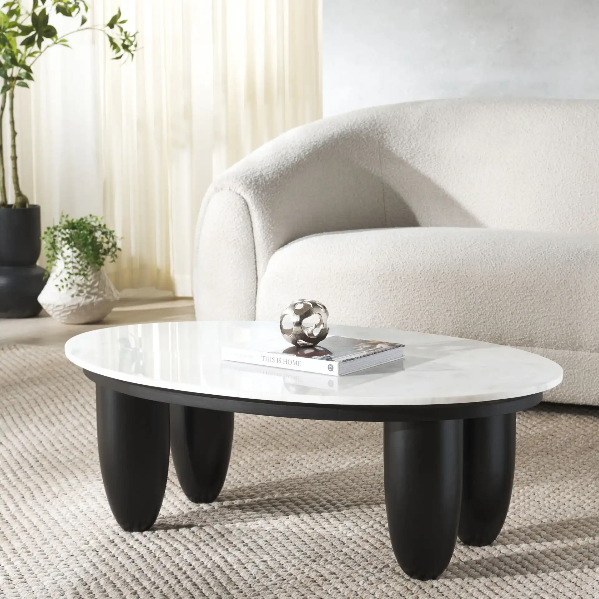 Hobbes Marble Top Coffee Table in Black / White in a styled room