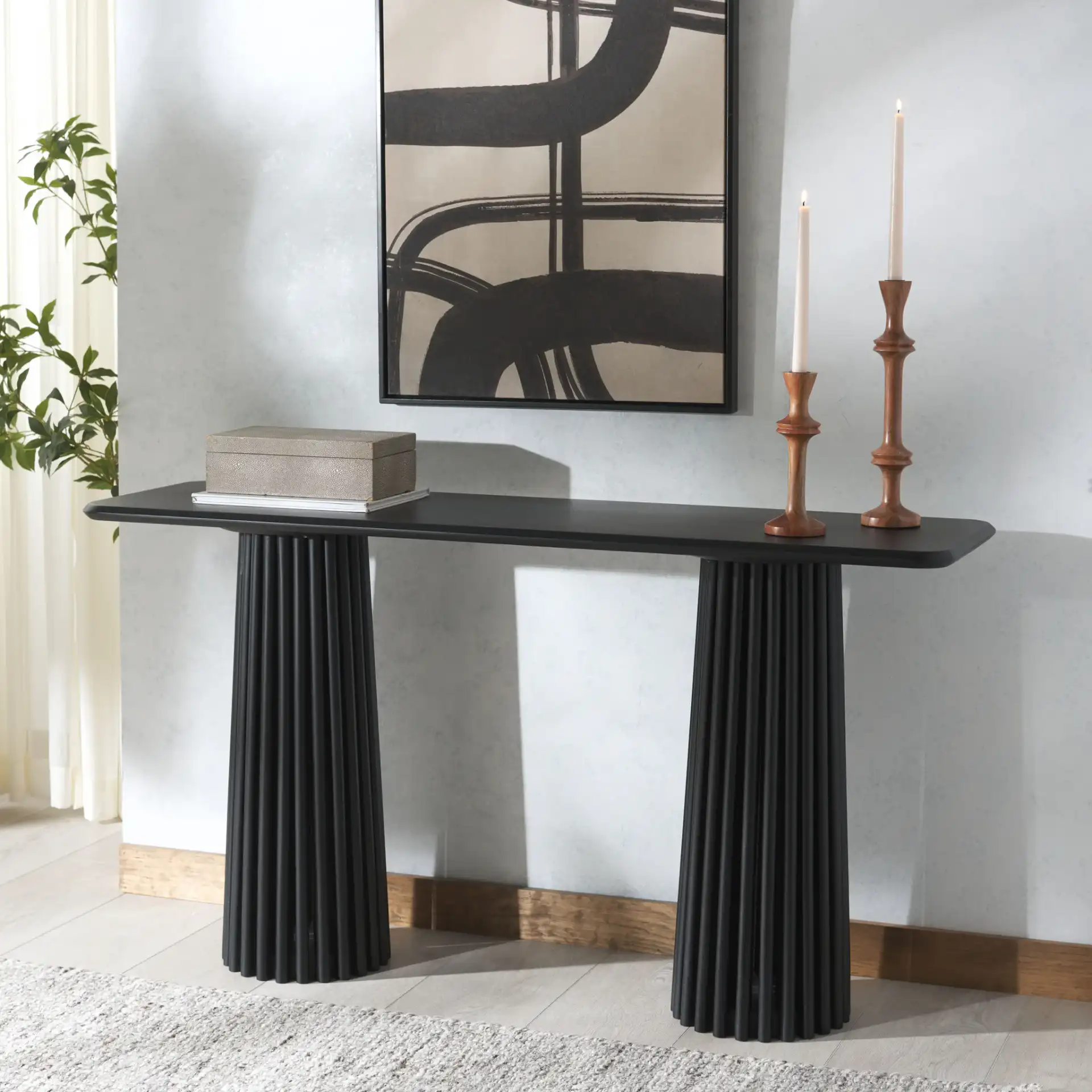 Penelope Wood Console Table in Black in a styled room