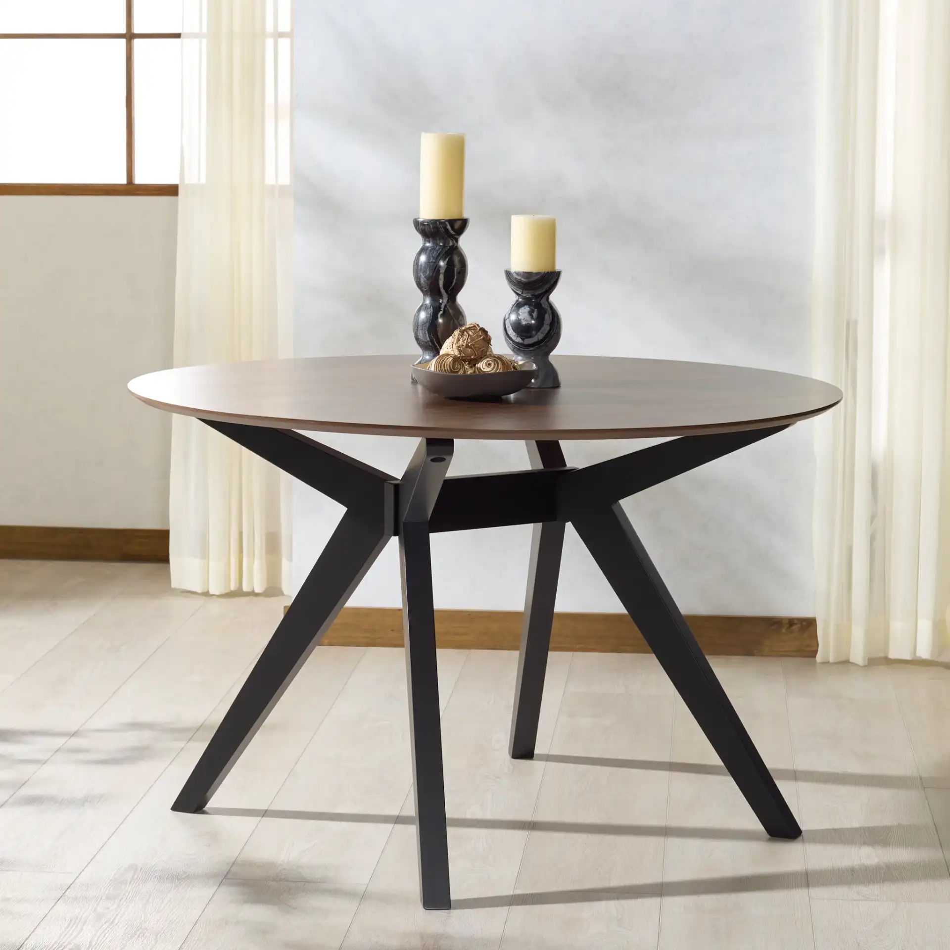 Rhonda Round Wood Dining Table in Walnut / Black in a styled room