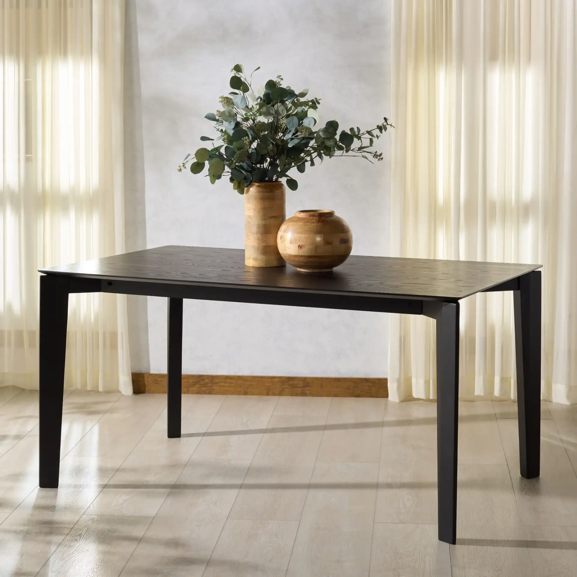 Alyssamarie Wood Dining Table in Black in a styled room