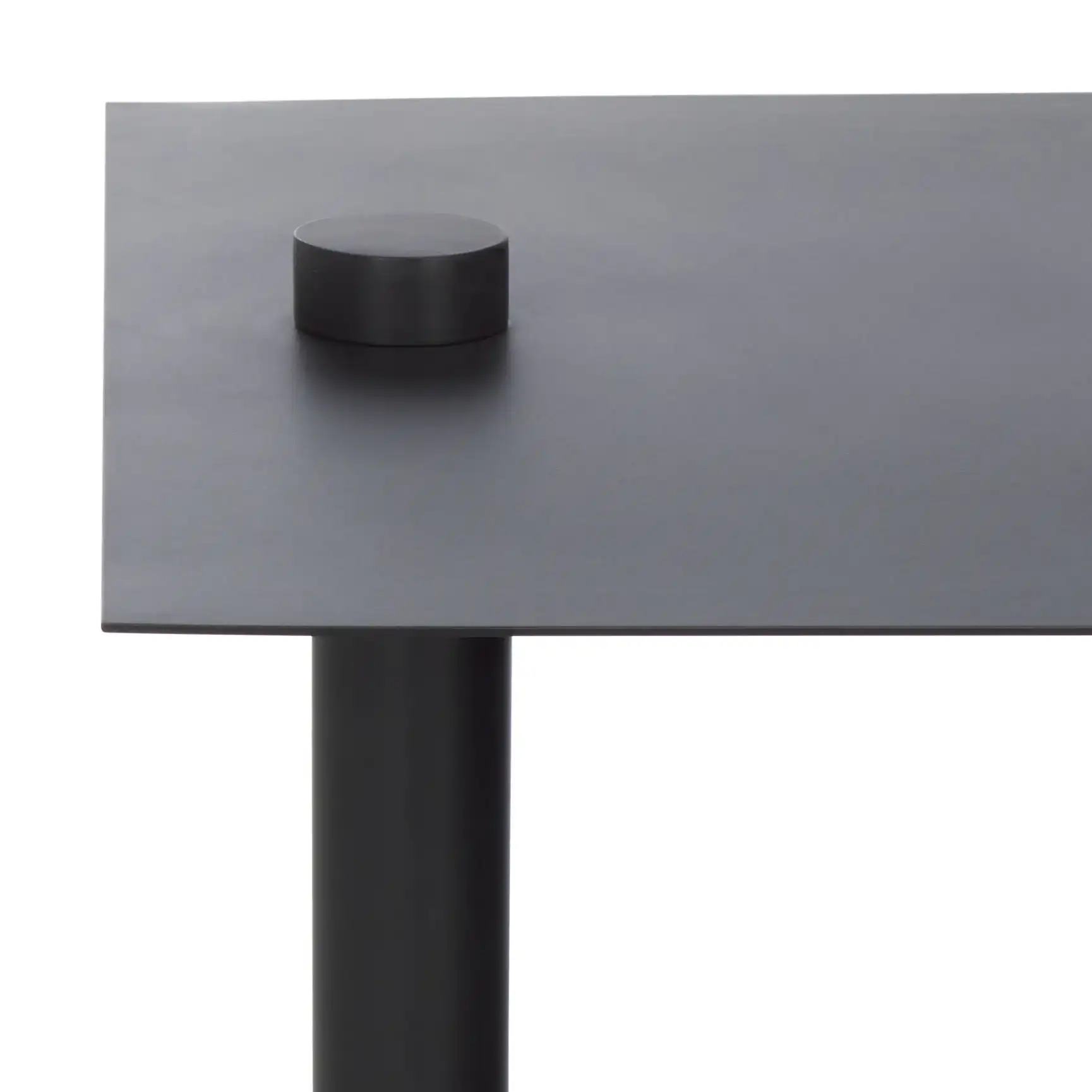 Aldwyn Metal Accent Table in Black in a styled room