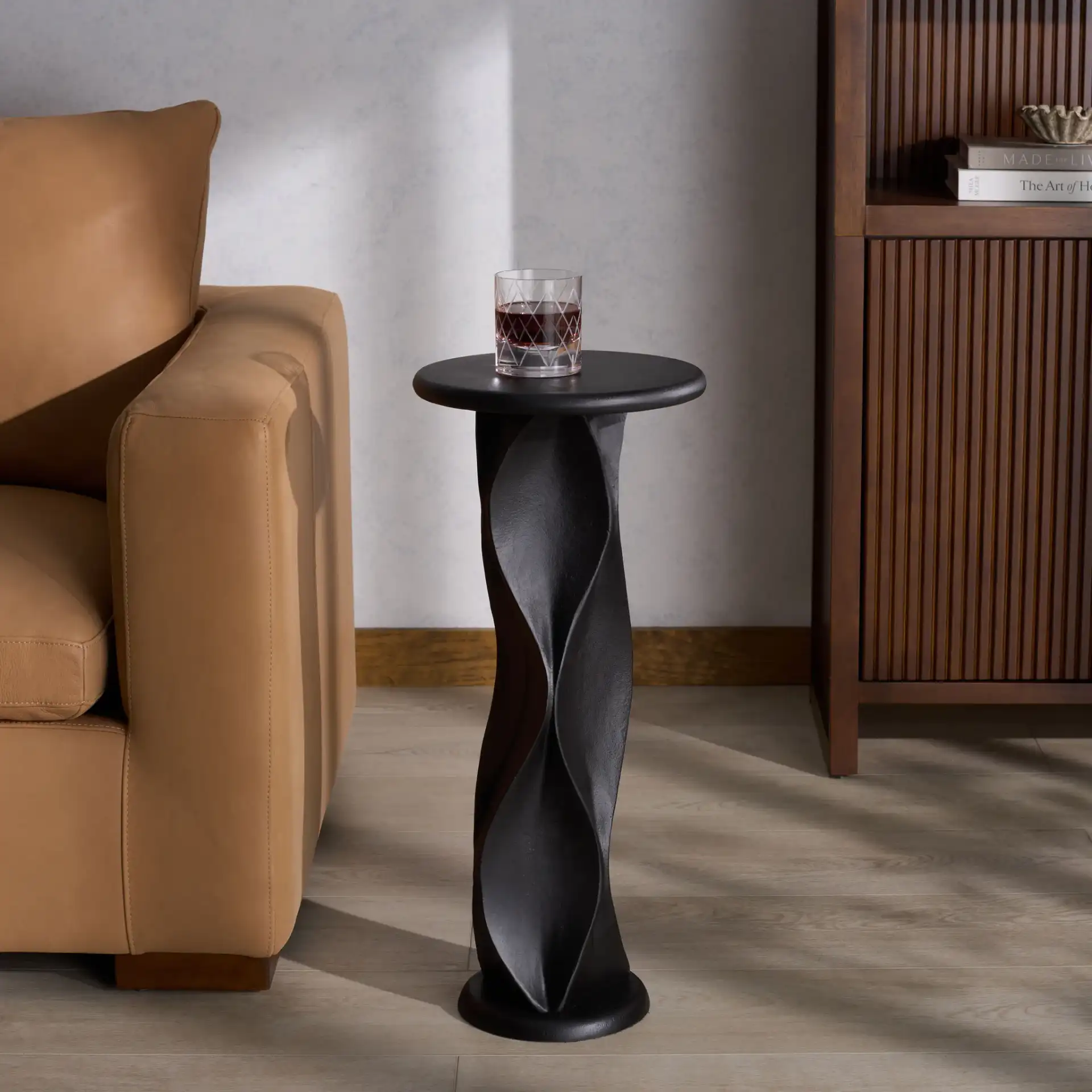 Zaylyn Metal Accent Table in Black in a styled room