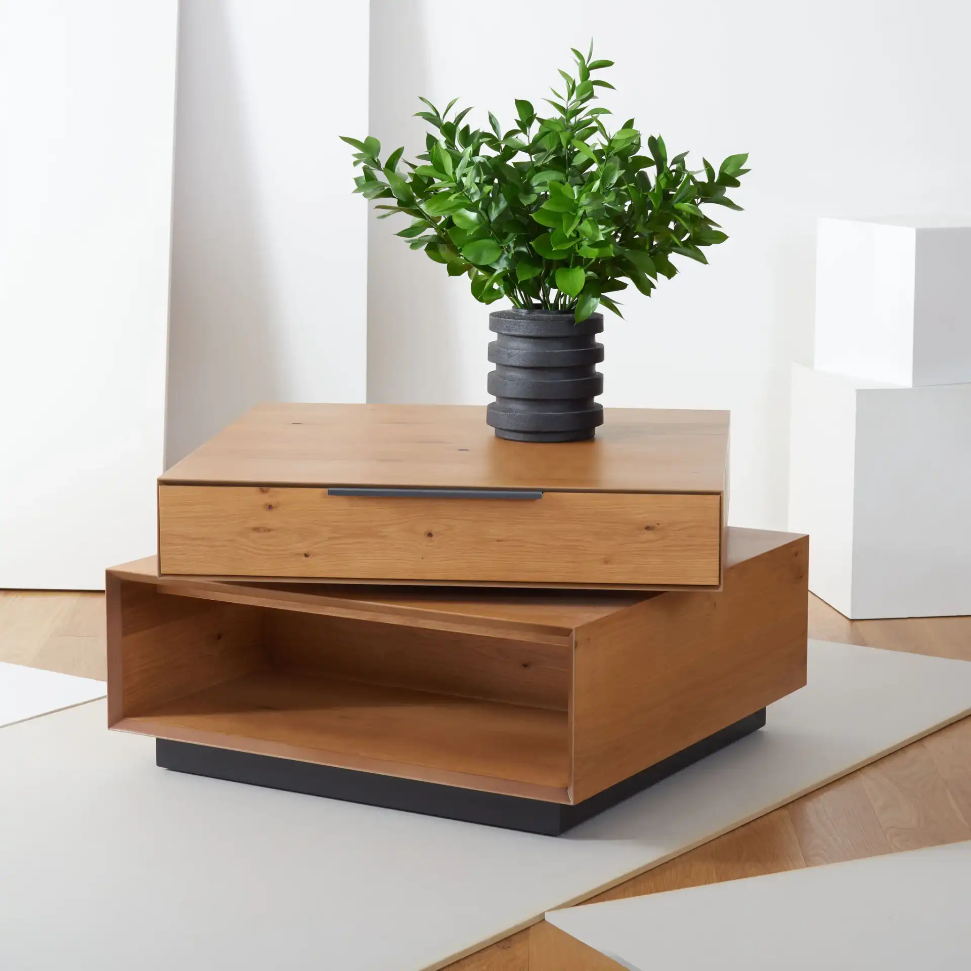 Geraldo Rotating Coffee Table in Oak in a styled room