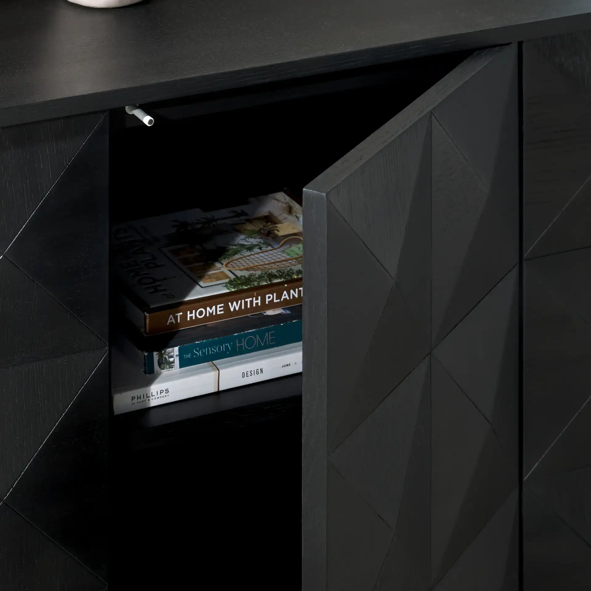 Patty Four-Door Sideboard in Black in a styled room