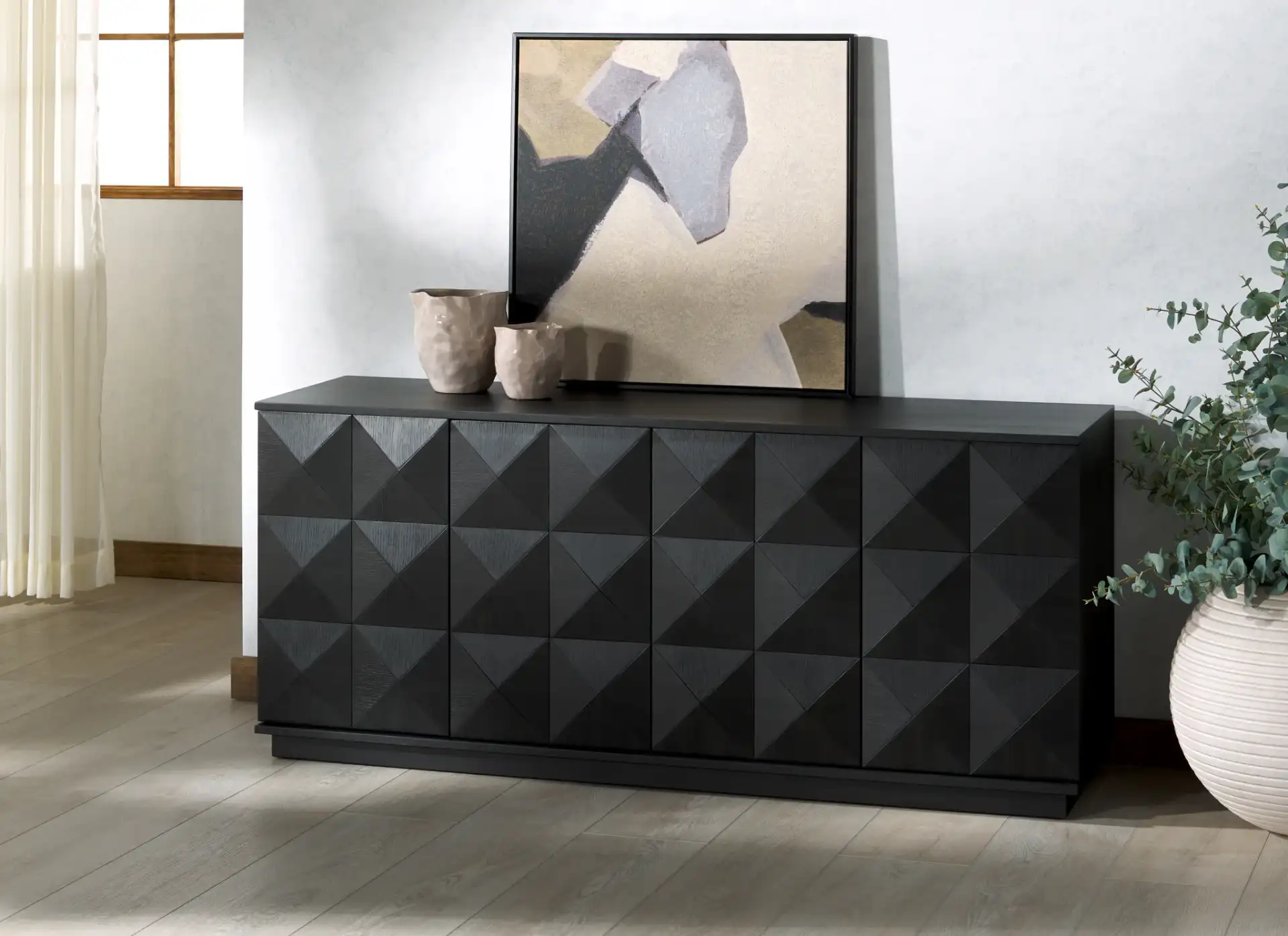 Patty Four-Door Sideboard in Black in a styled room