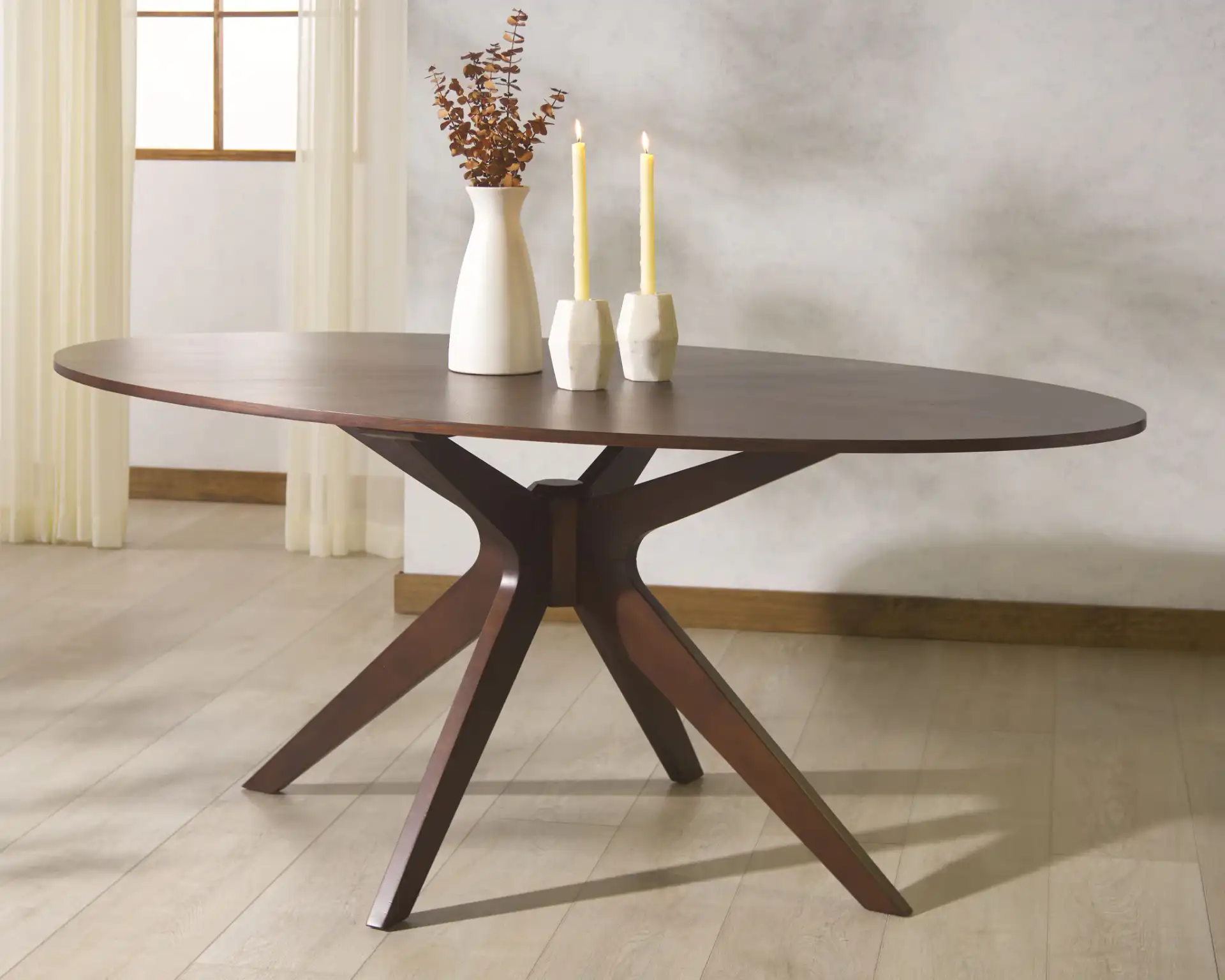 Hawkins Wood Oval Dining Table in Walnut in a styled room