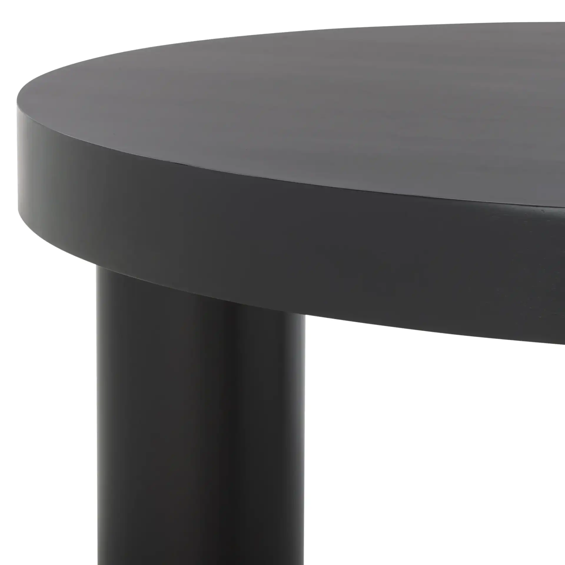 Bary Round Three-Leg Wood Coffee Table in Black in a styled room