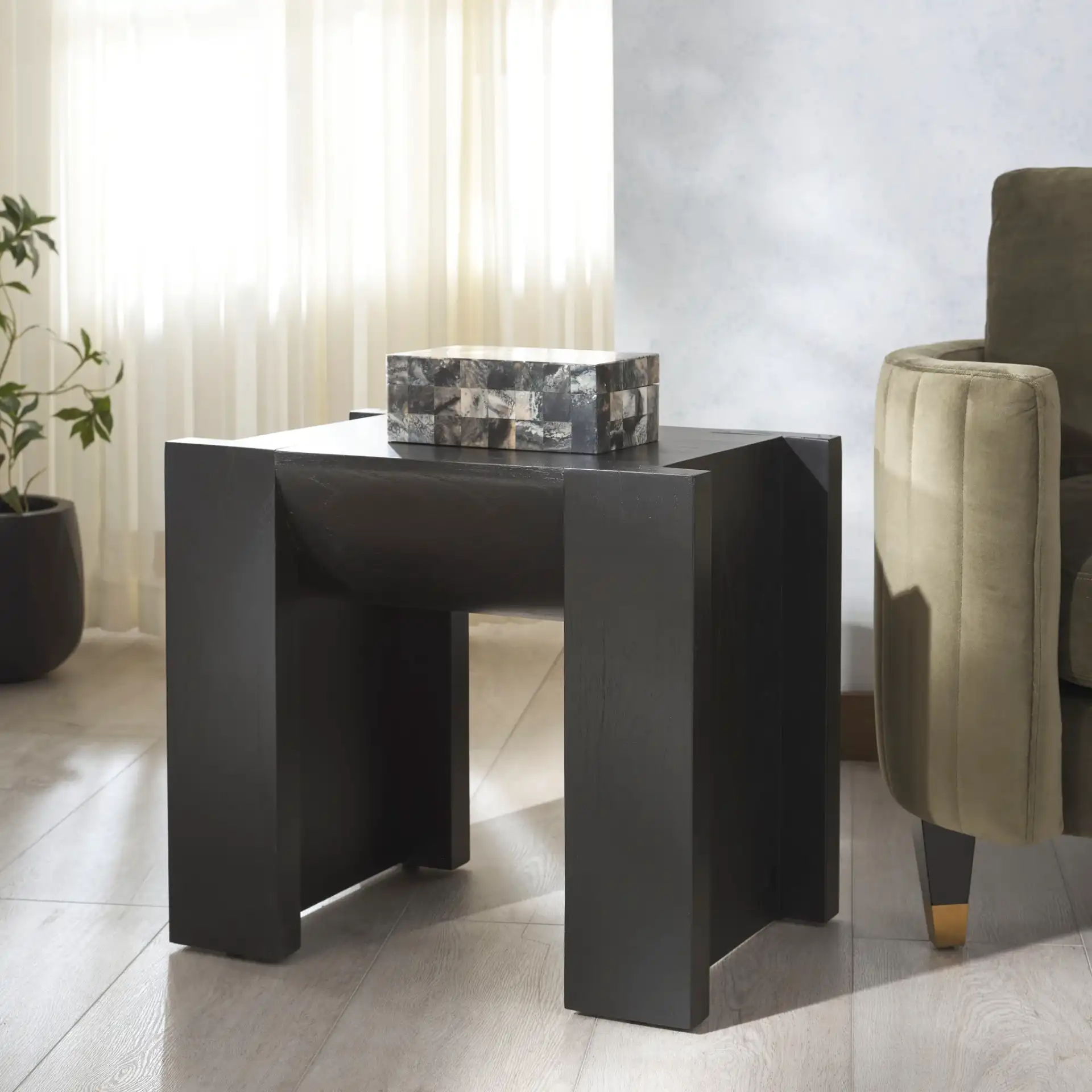Jessandria Wood Accent Table in Black in a styled room