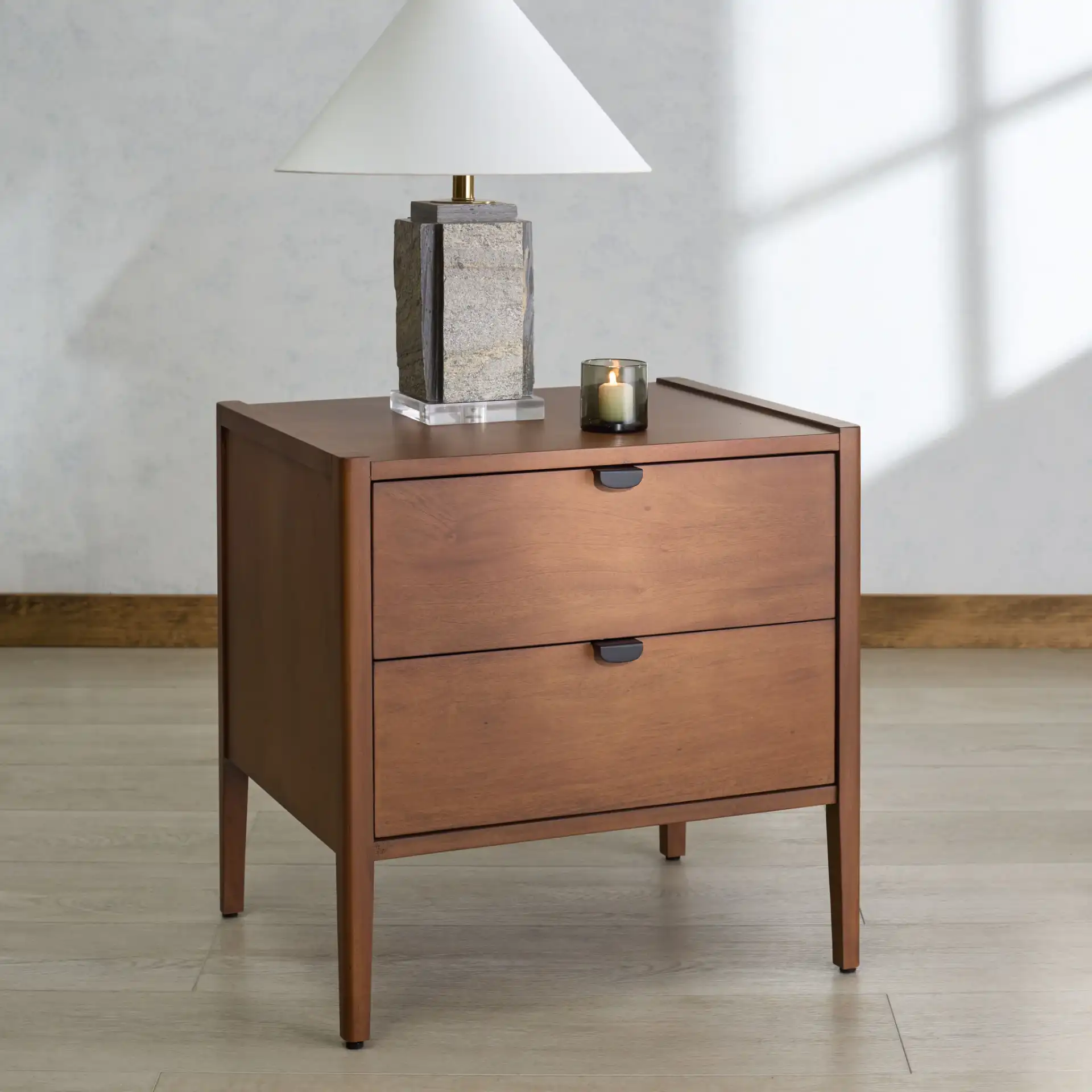 Mayalyn Wood Two-Drawer Nightstand in Walnut / Black in a styled room