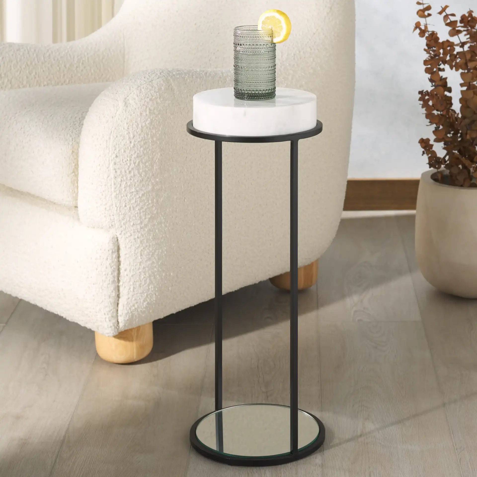 Jennibelle Marble Drink Table in Black / White in a styled room