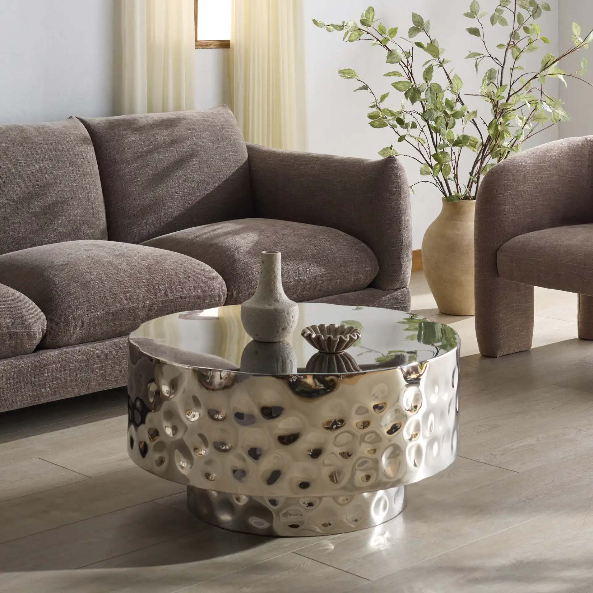 Janalee Steel Coffee Table in Charcoal in a styled room