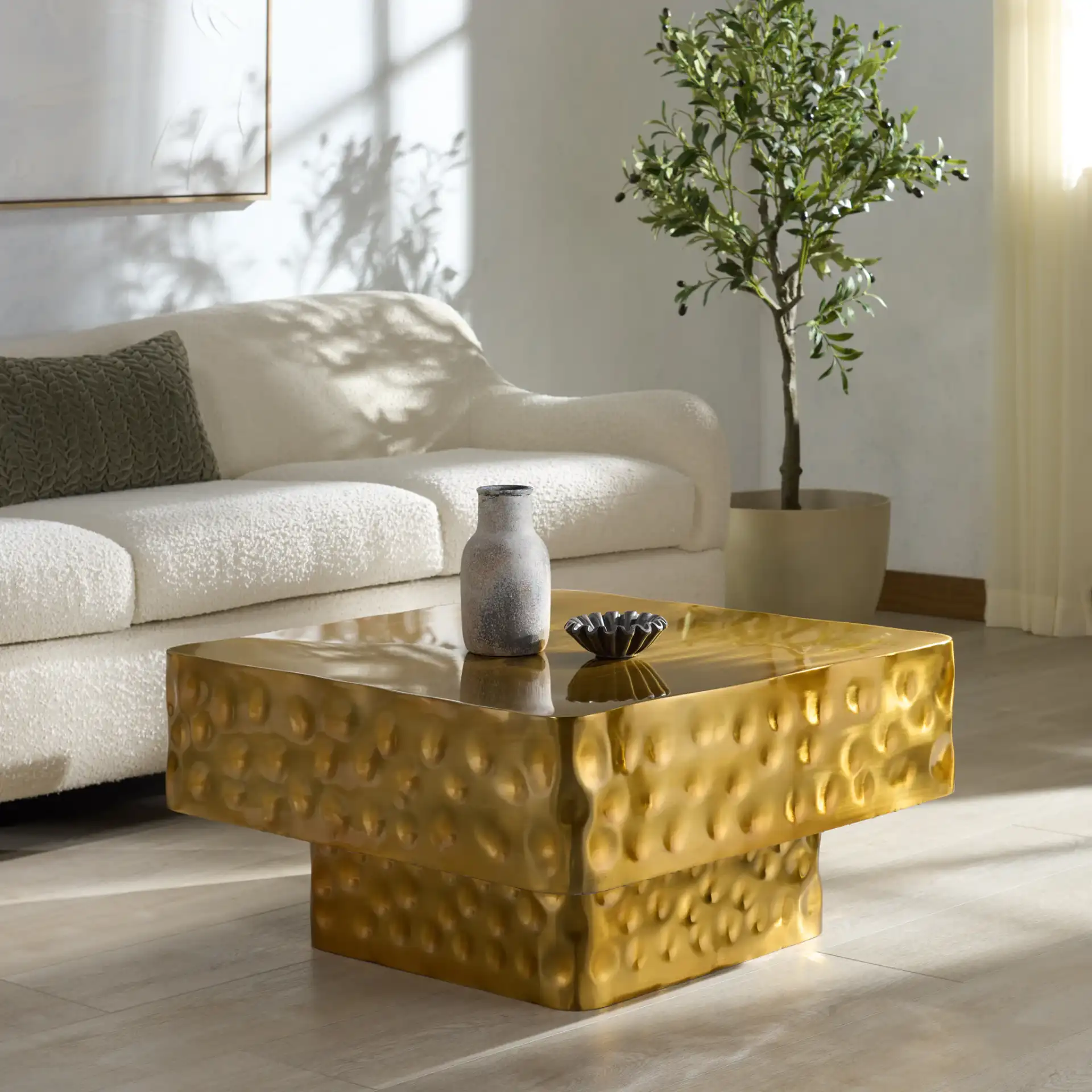 Janalee Steel Square Coffee Table in Champagne in a styled room