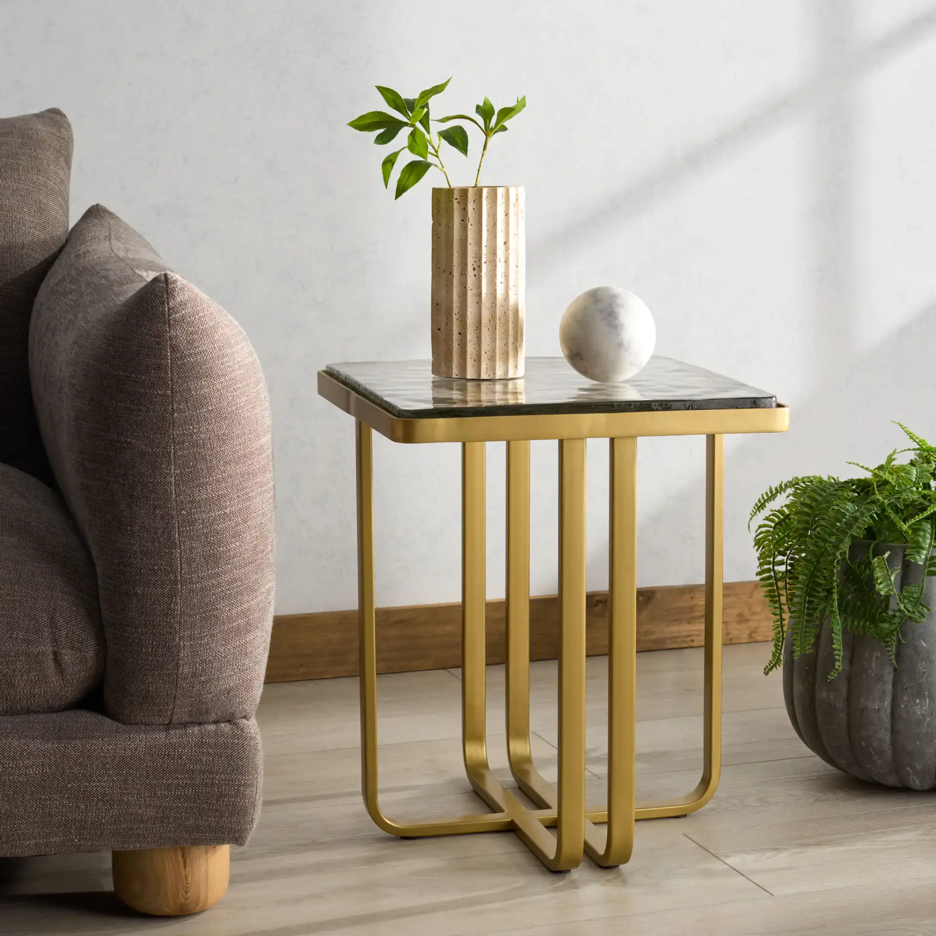 Dominic Glass Top Accent Table in Brass / Clear in a styled room