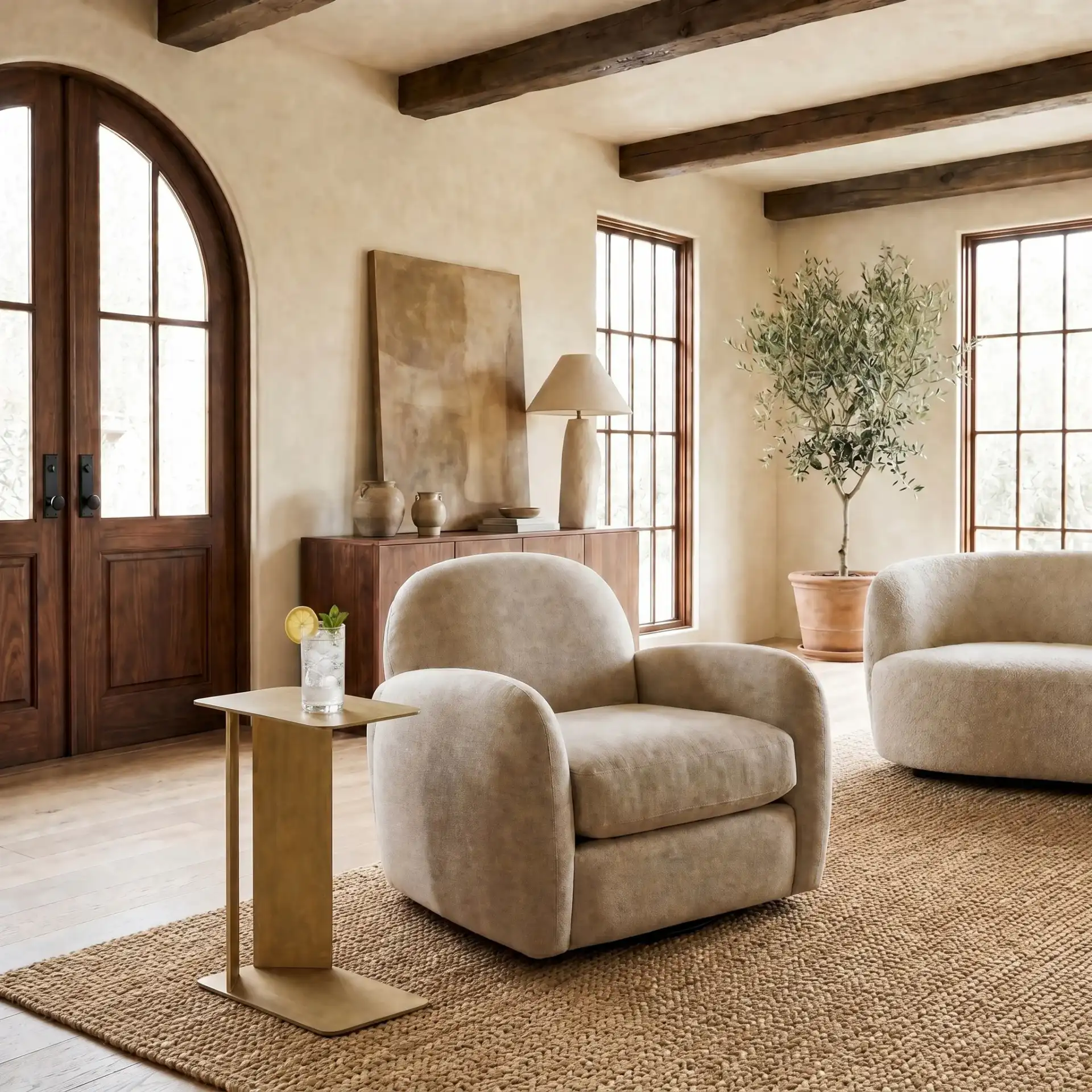 Ortiz Metal Accent Table in Antique Brass in a styled room