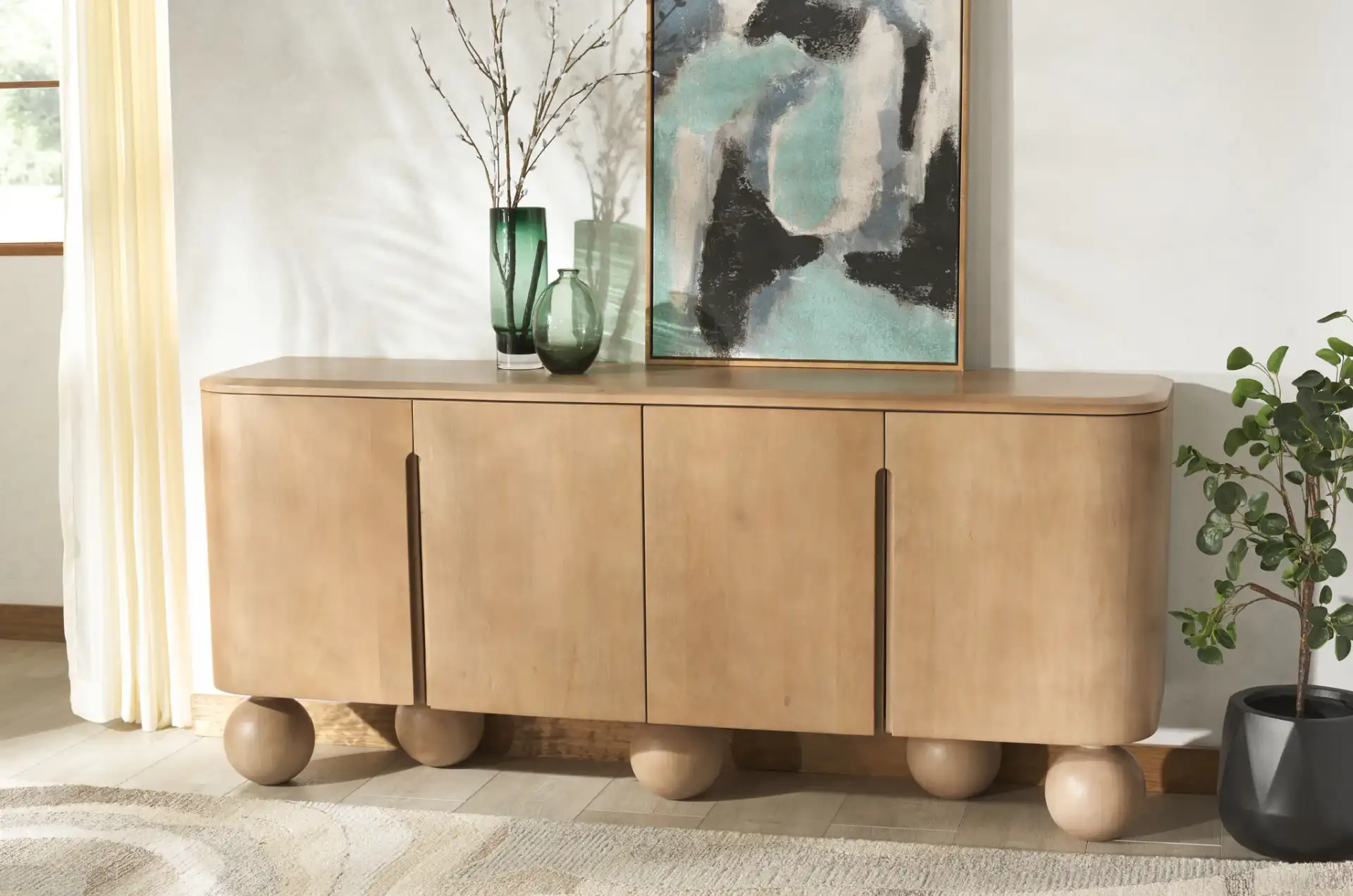 Tuckerman Four-Door Wood Sideboard in Natural in a styled room