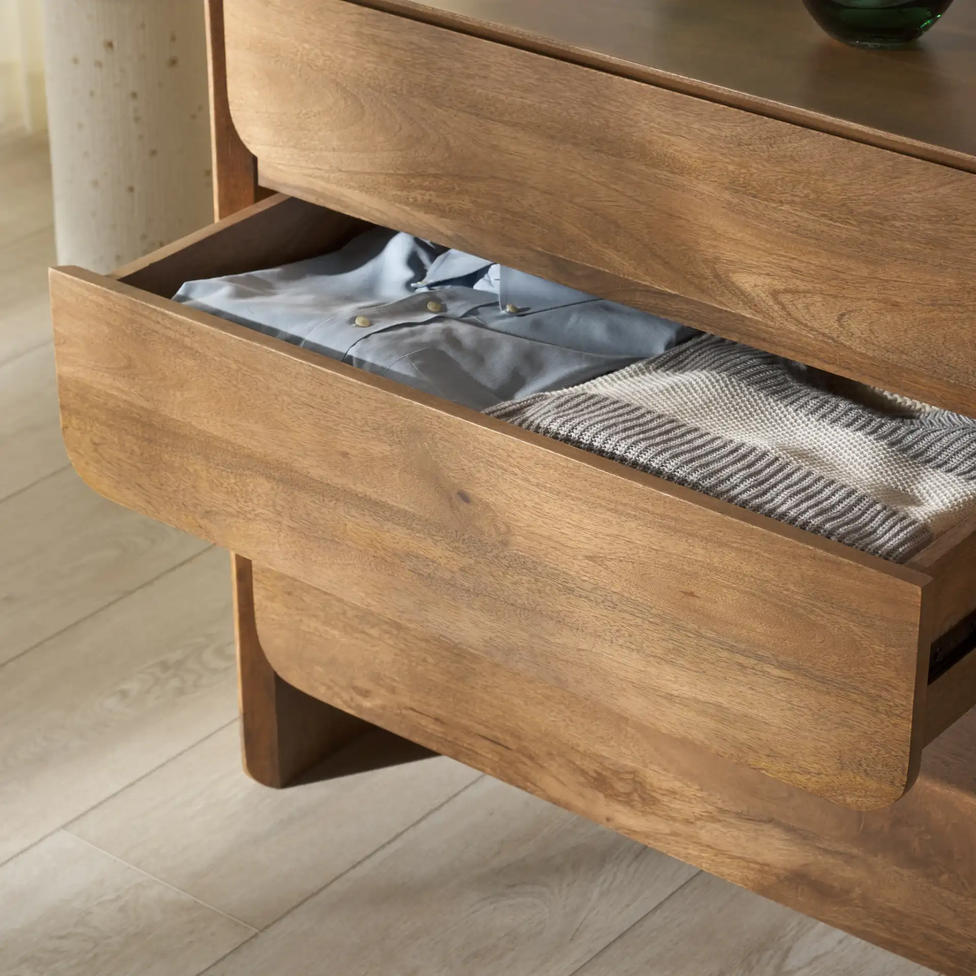 Grigorio Six-Drawer Dresser in Brown in a styled room