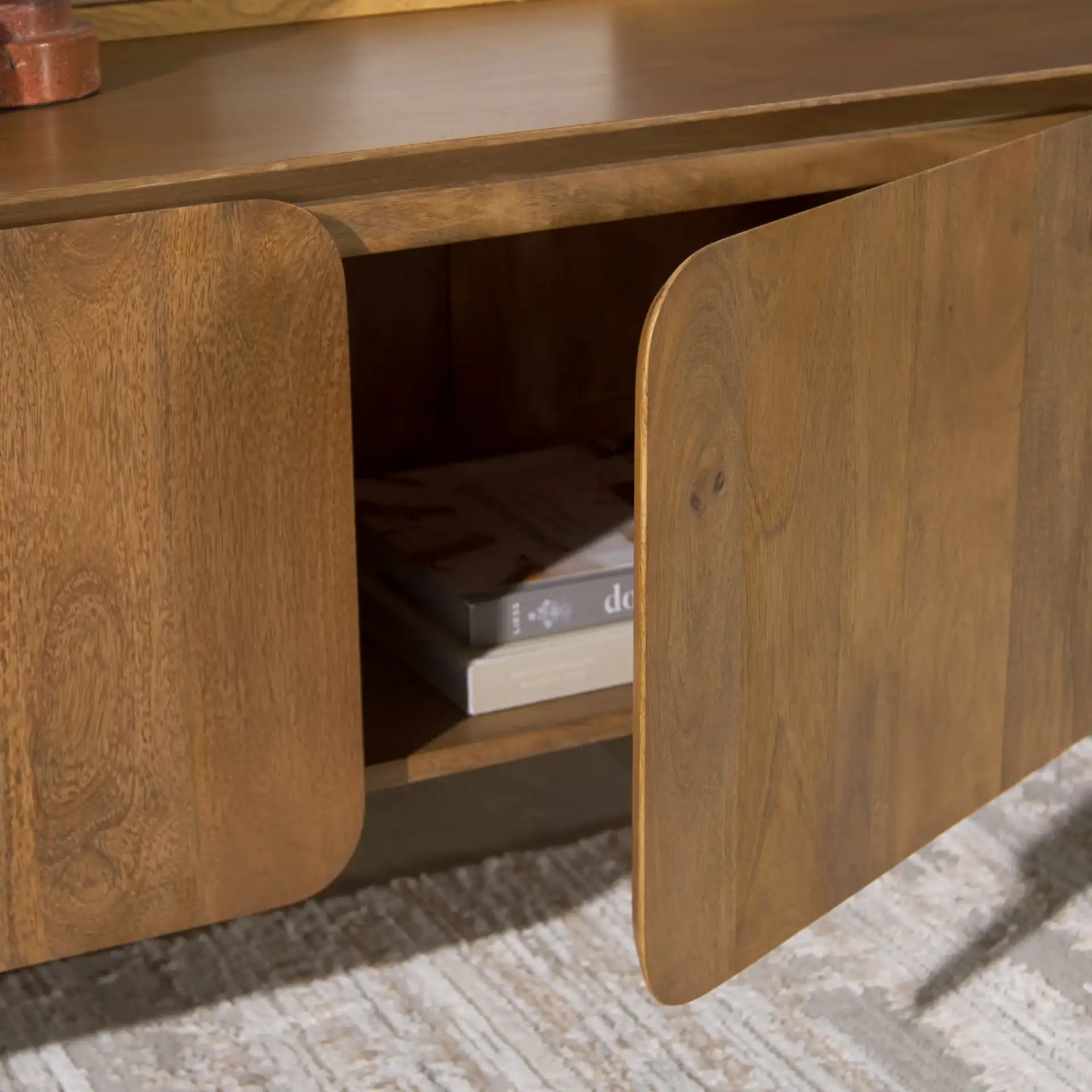 Grigorio Three-Door Wood Sideboard in Brown in a styled room