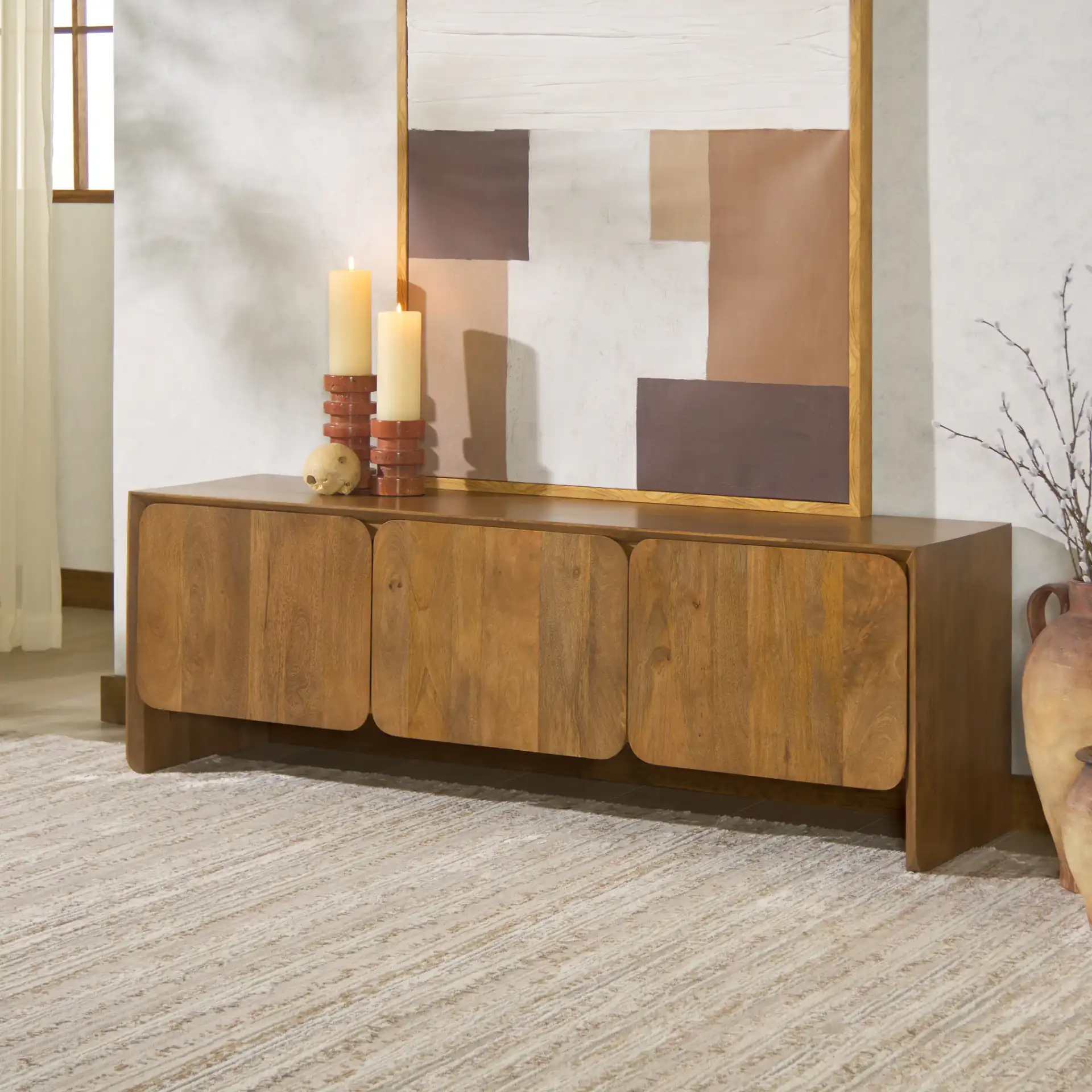 Grigorio Three-Door Wood Sideboard in Brown in a styled room