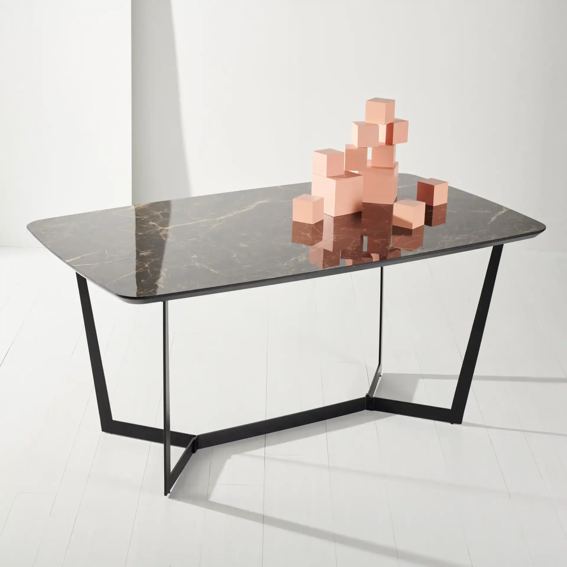 Britta Metal Dining Table in Black in a styled room