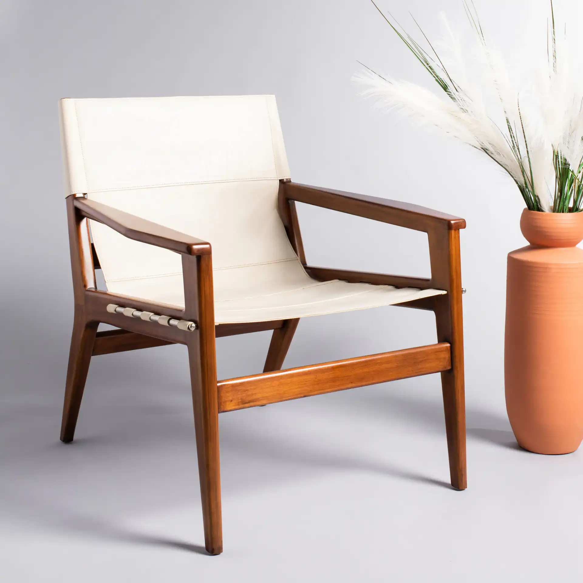 Culkin Leather Sling Chair in Black / White in a styled room