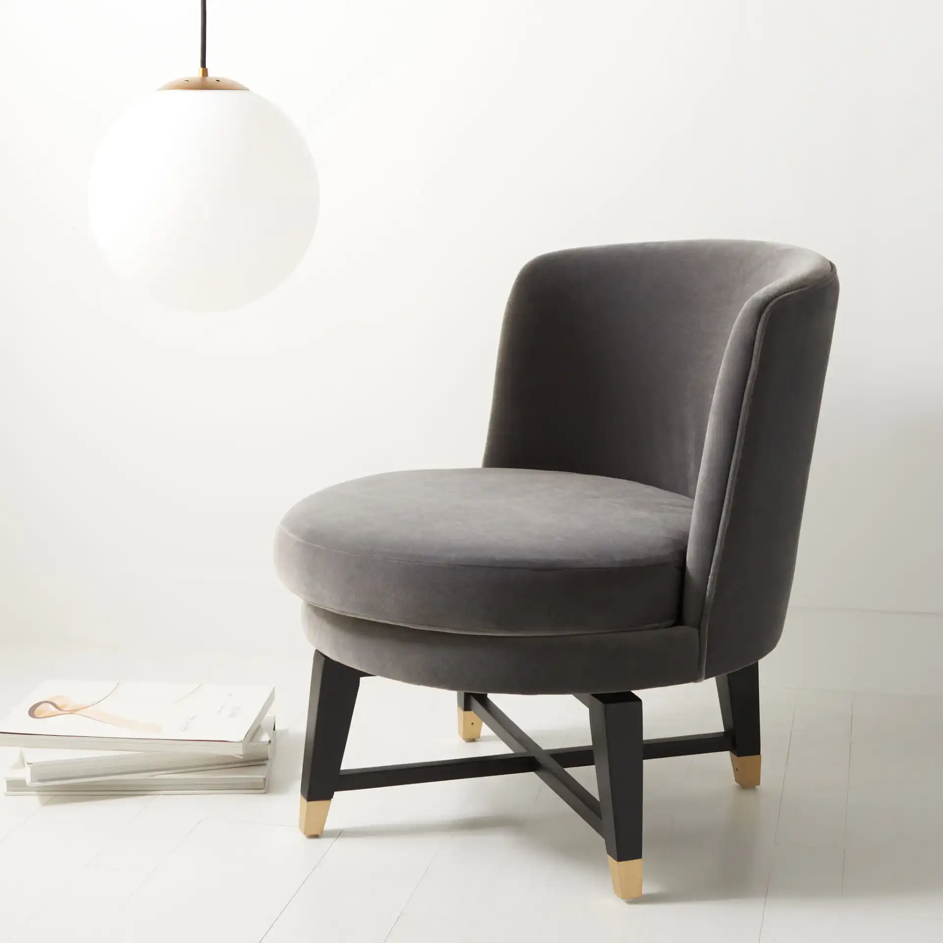 Trinity Swivel Accent Chair in Charcoal in a styled room