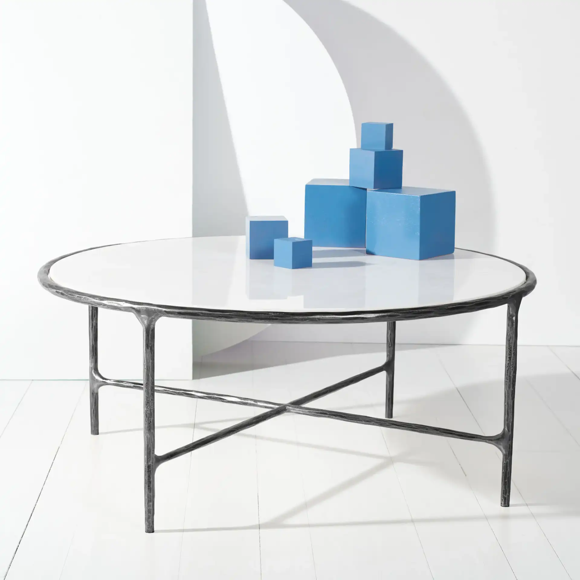 Jessa Round Metal Coffee Table in Black / White in a styled room