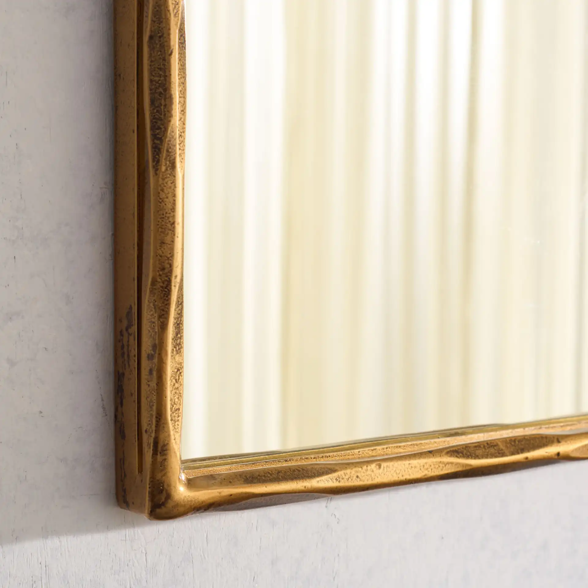 Jessa Small Rectangle Mirror in Brass in a styled room