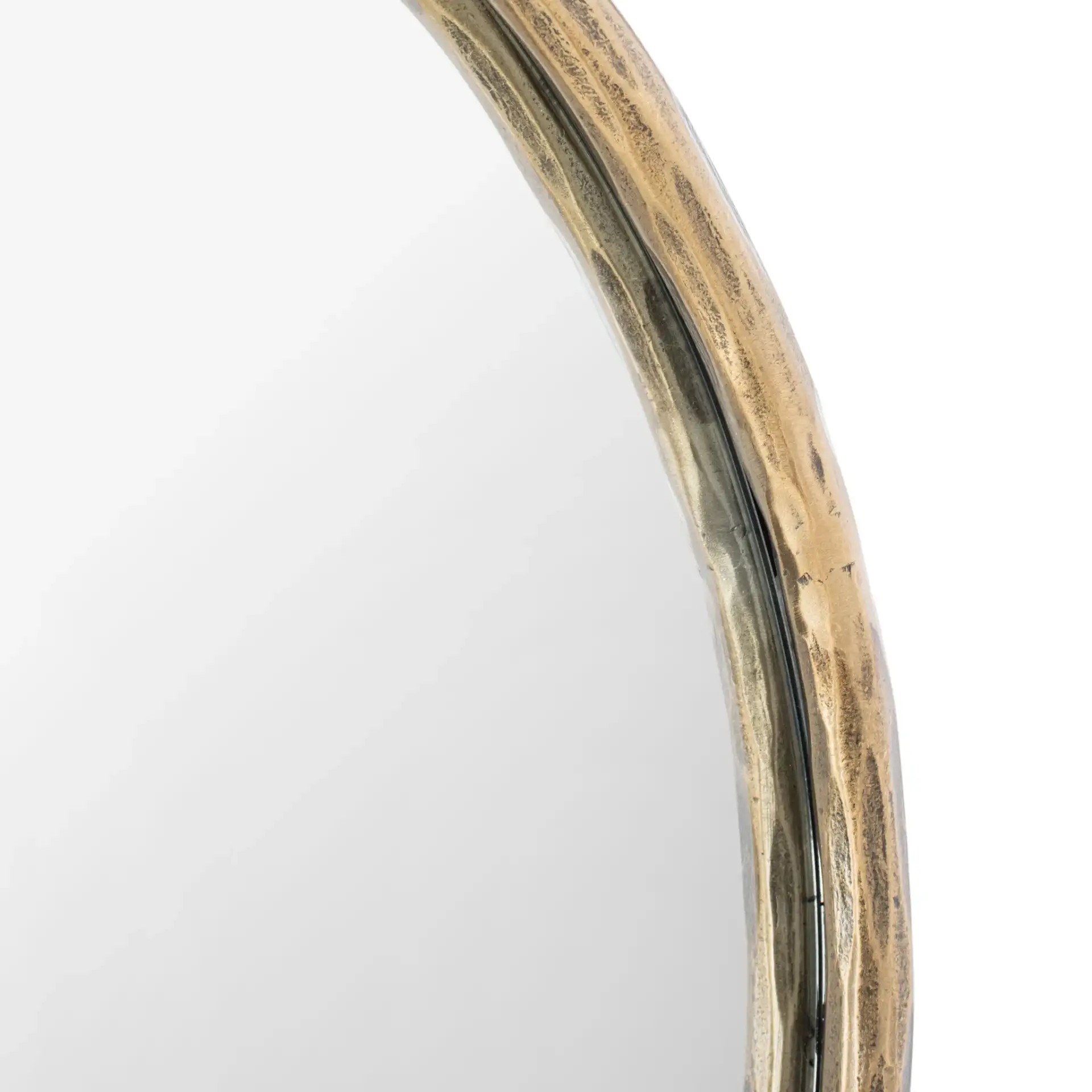 Jessa Oval Metal Mirror in Brass in a styled room
