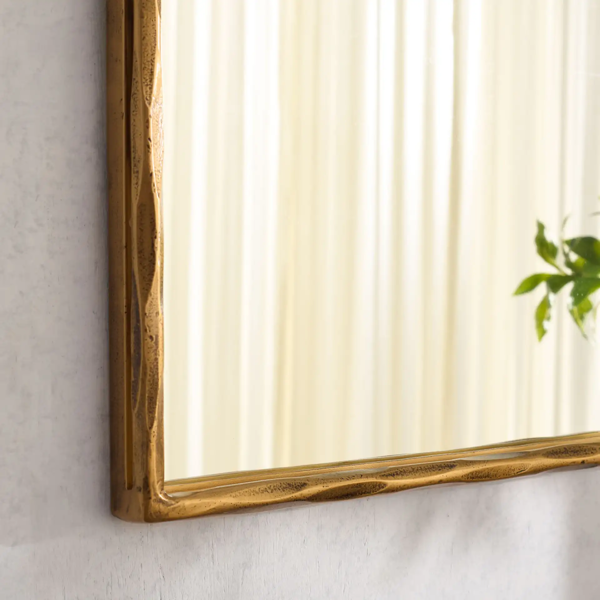 Jessa 32" Square Metal Mirror in Brass in a styled room