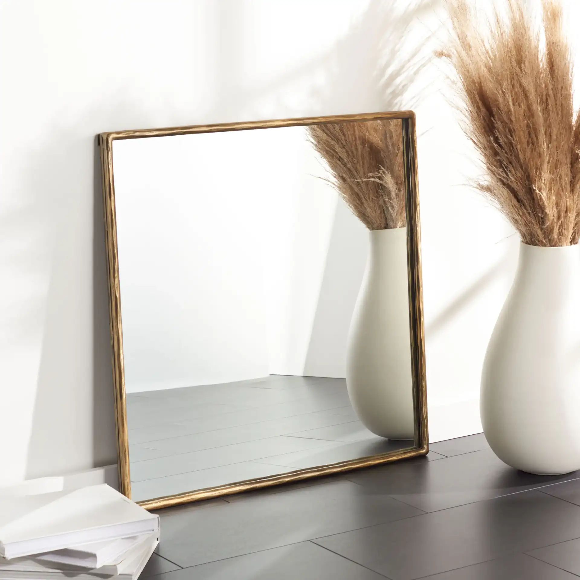 Jessa 32" Square Metal Mirror in Brass in a styled room
