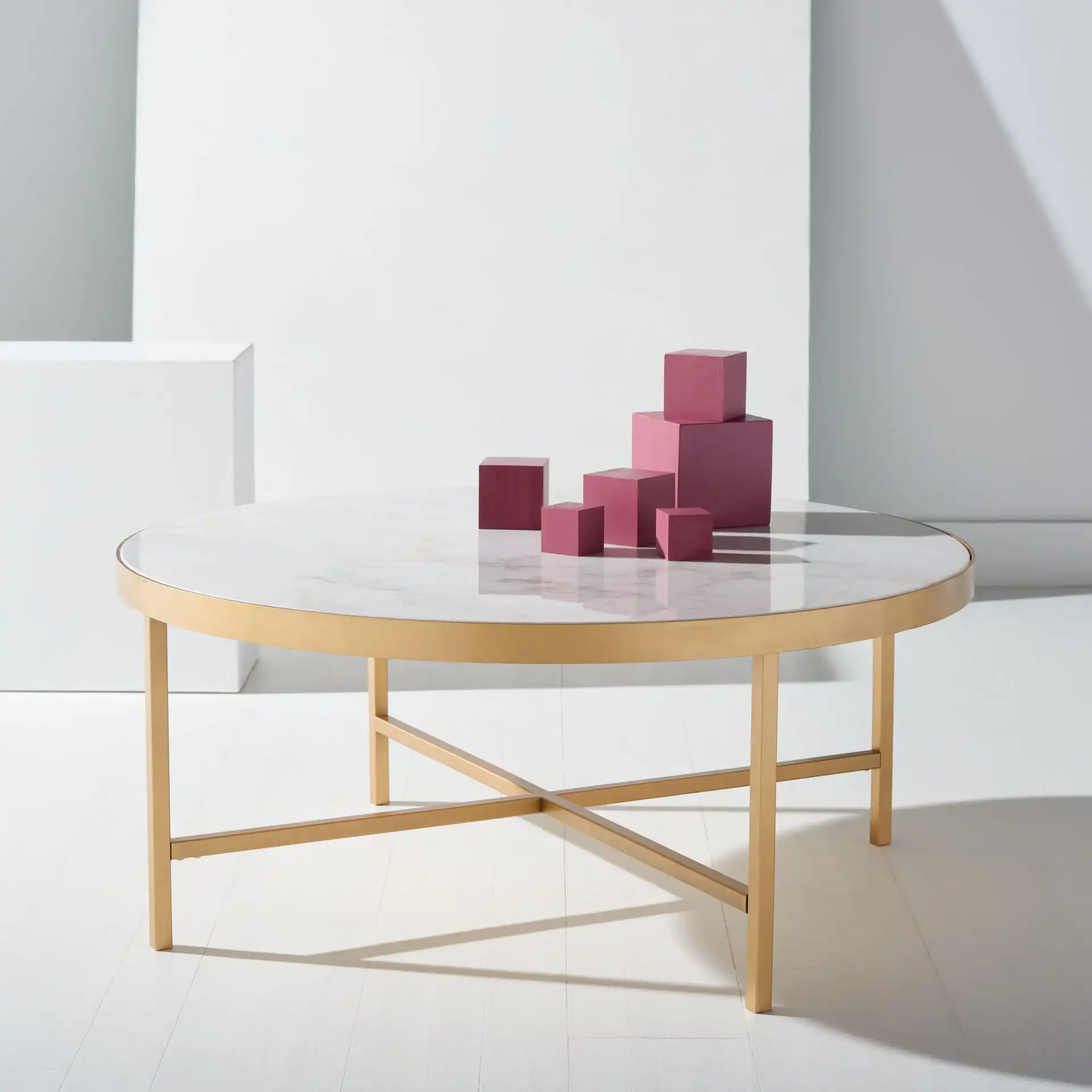 Caralyn Round Marble Coffee Table in White / Brass in a styled room