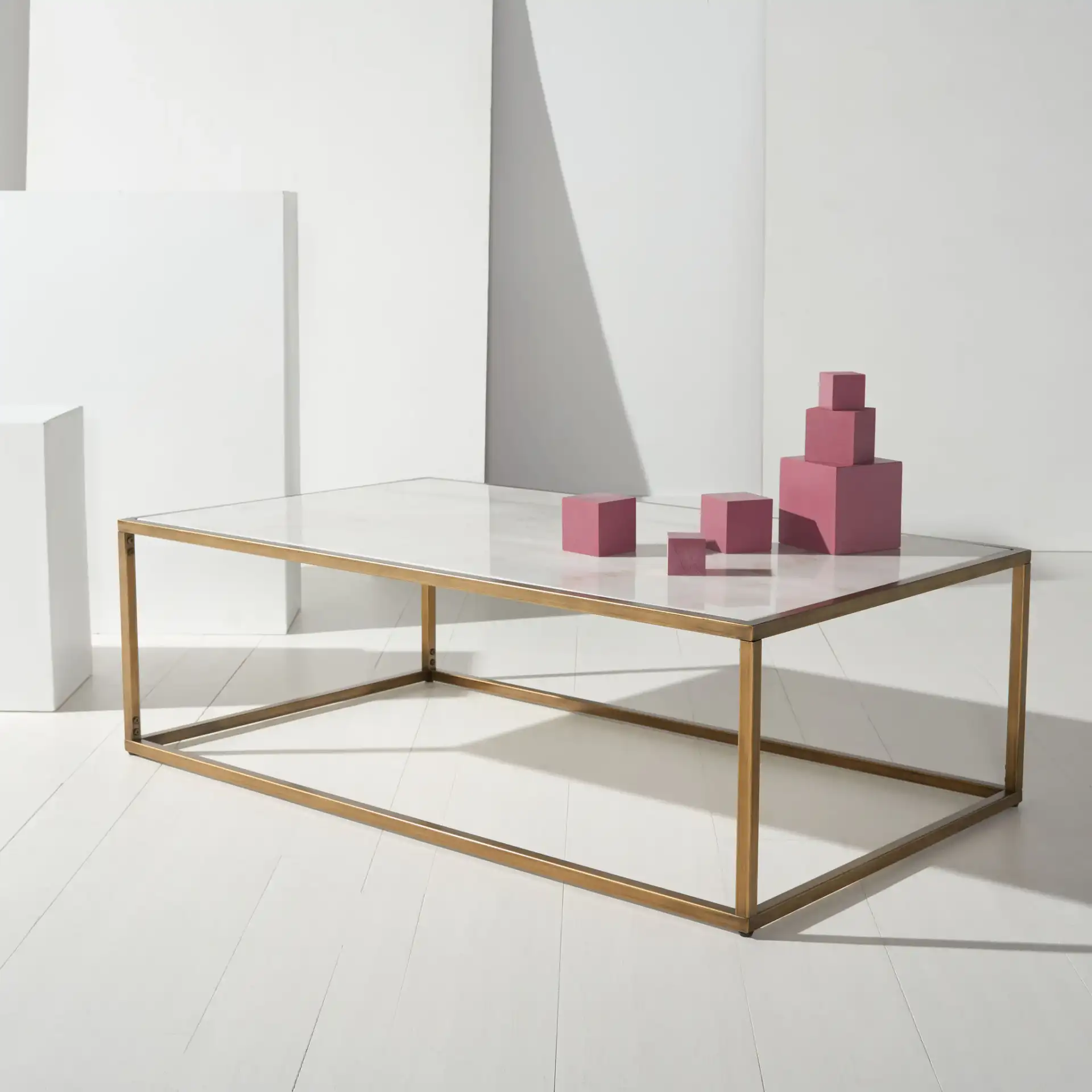 Brynna Rectangular Marble Coffee Table in Bronze / White in a styled room