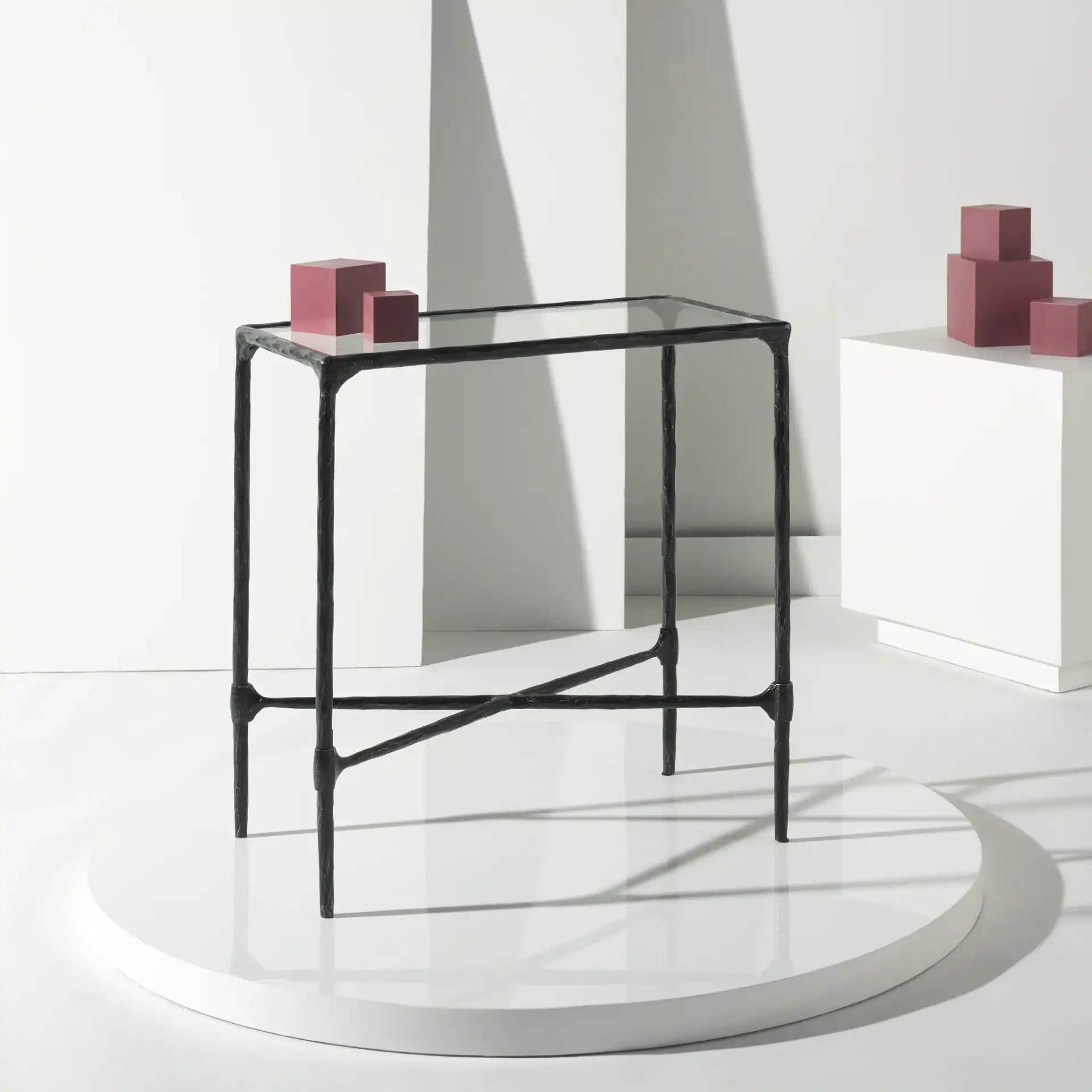 Isabellina Metal Accent Table in Black / Clear in a styled room