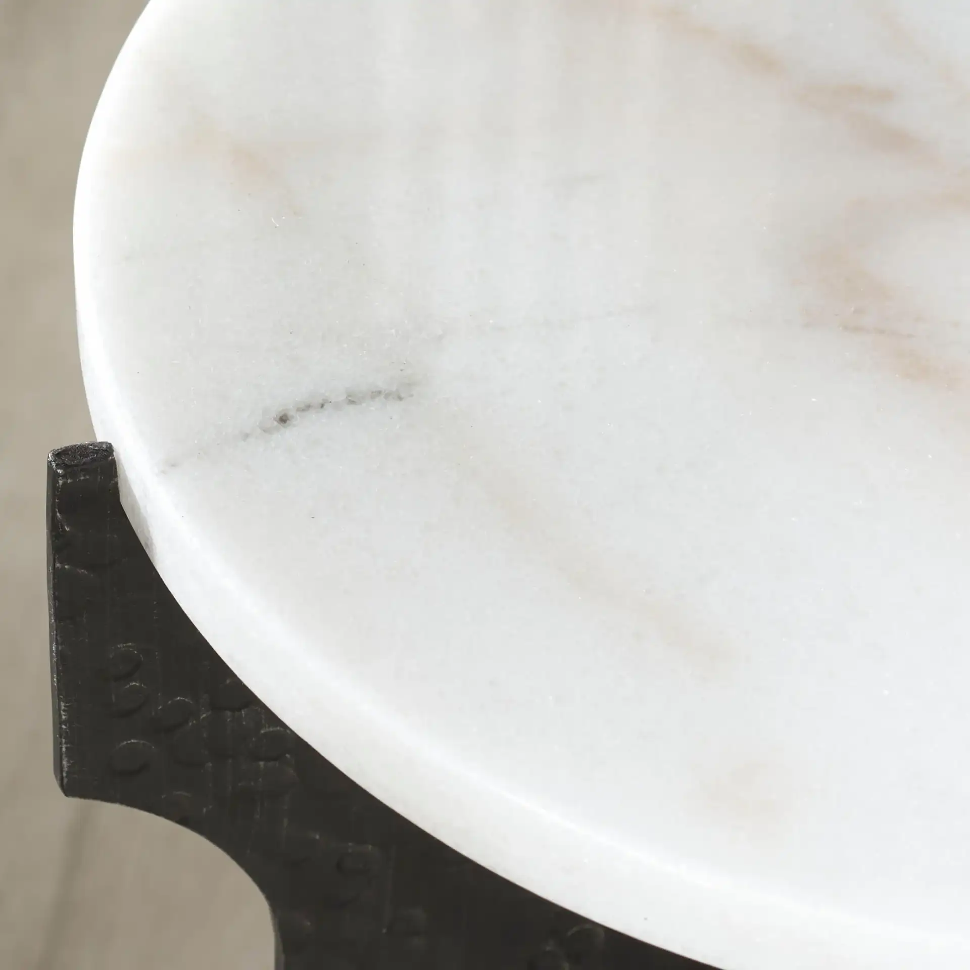Tayanna Metal Accent Table in Black / White in a styled room