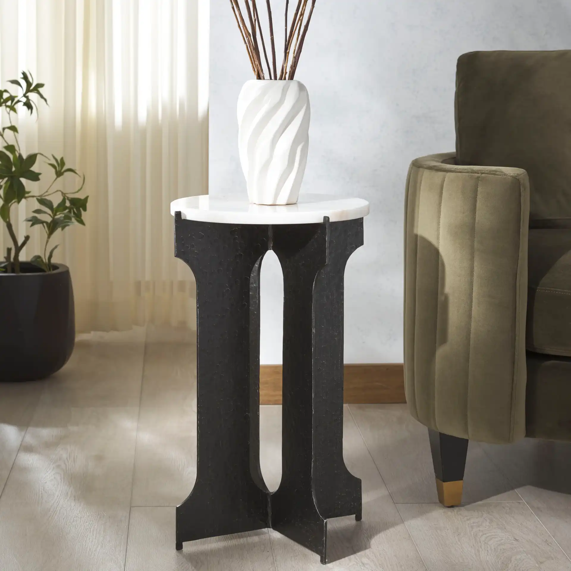 Tayanna Metal Accent Table in Black / White in a styled room