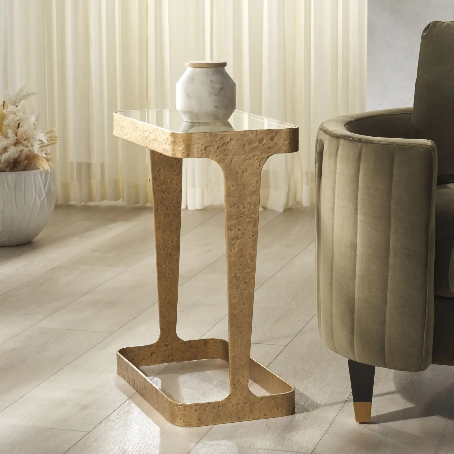 Viktor Metal Accent Table in Brass / Clear in a styled room
