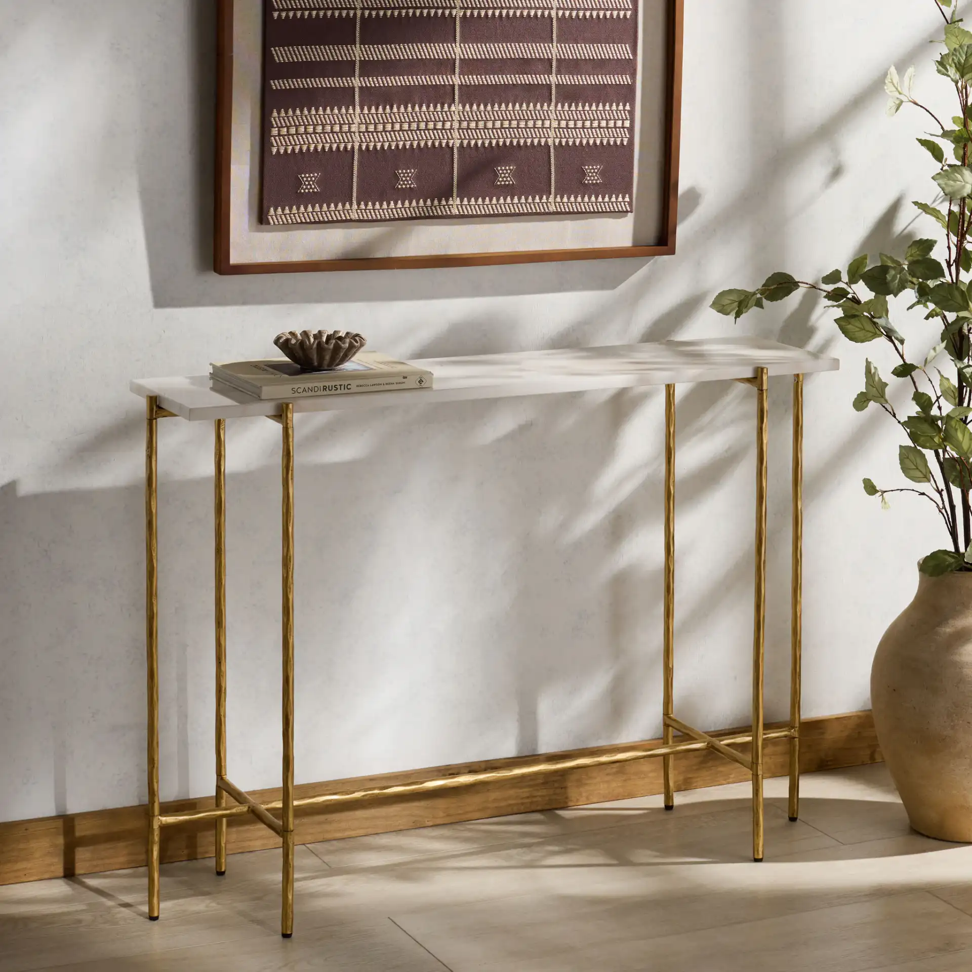 Giorgi Marble Top Console Table in Brass / White in a styled room