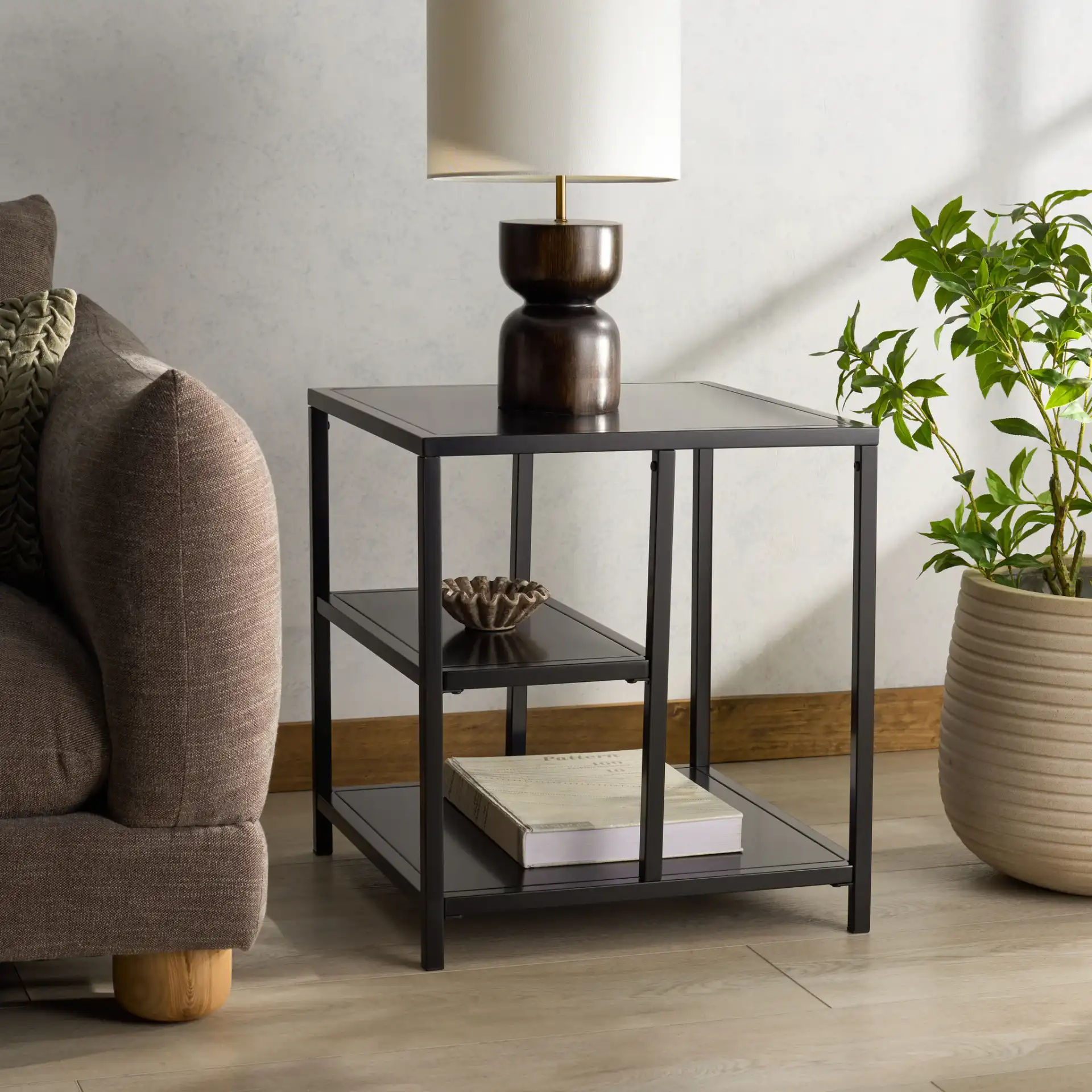 Hodge Metal Accent Table in Black in a styled room