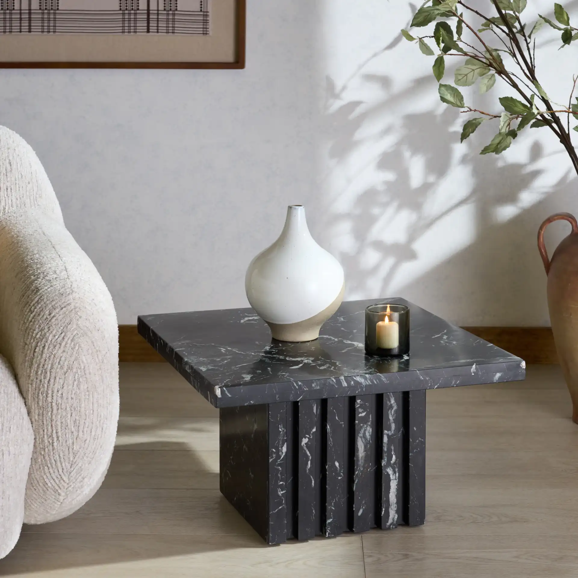 Olivia Square Travertine Accent Table in Brown in a styled room
