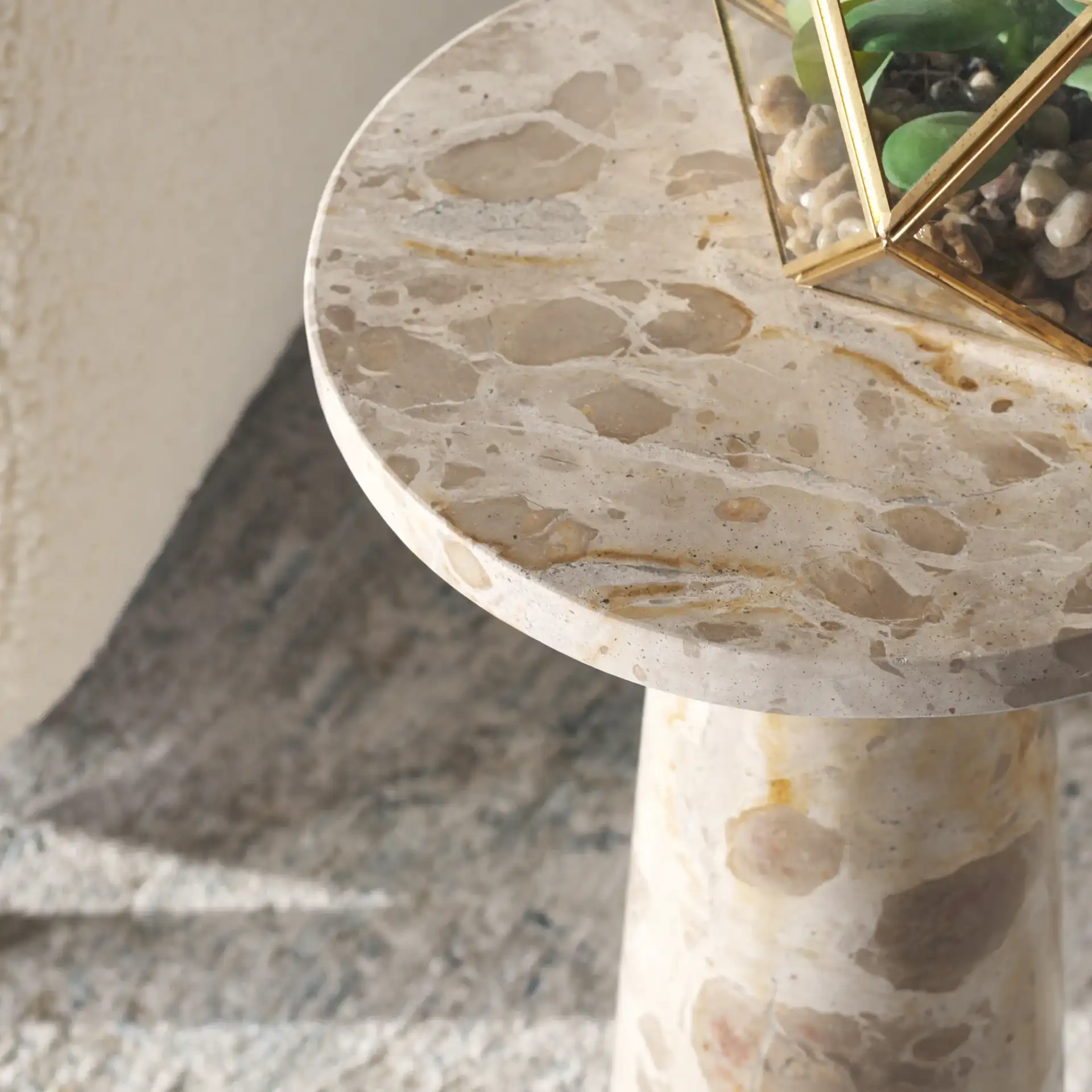 Valentia Round Marble Accent Table in Beige in a styled room