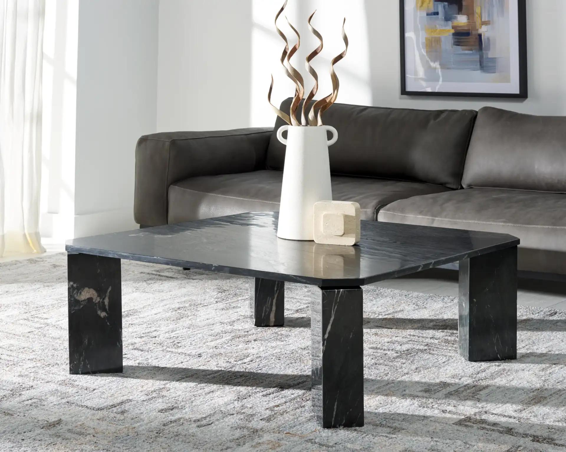 Daysi Marble Coffee Table in Black in a styled room