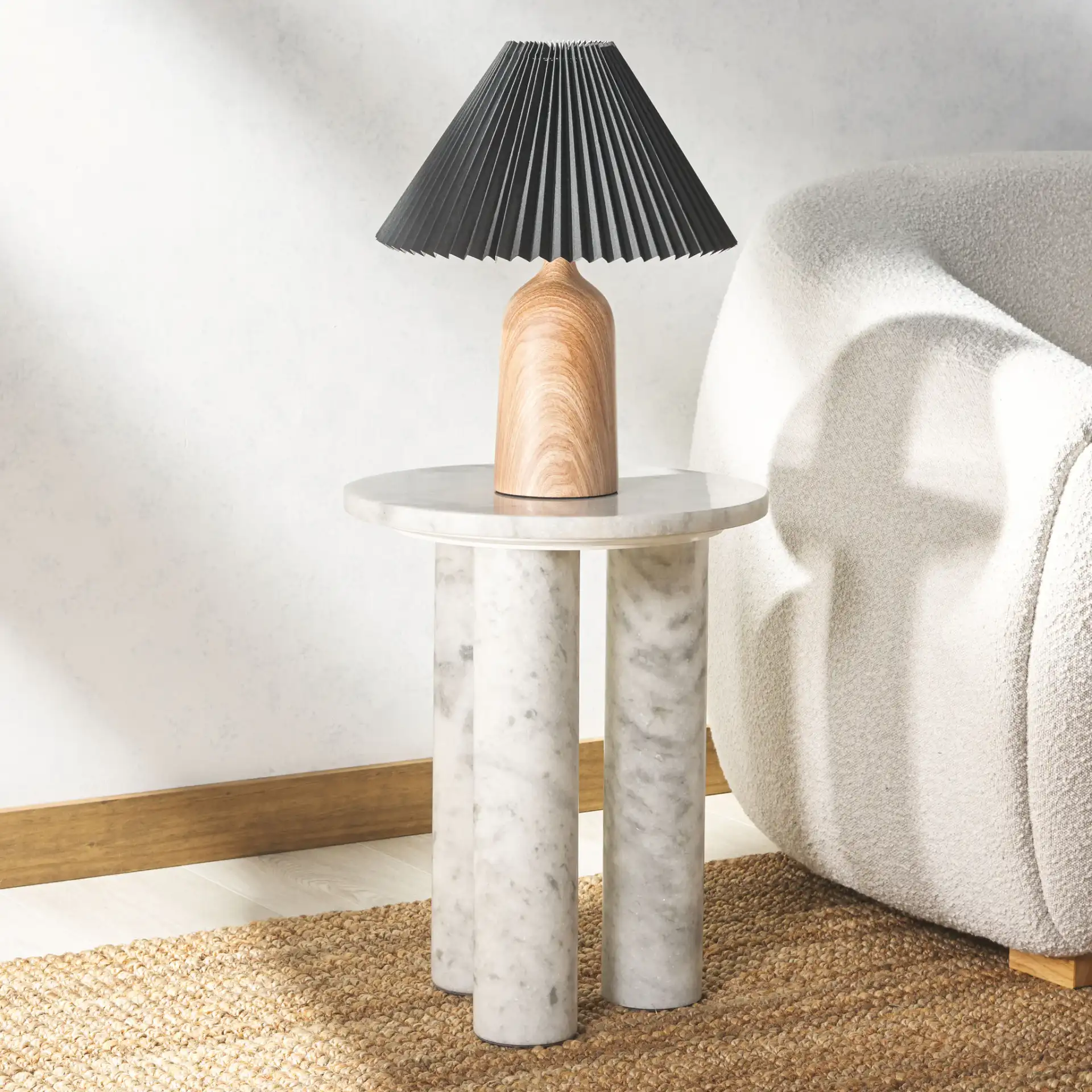 Giabella Marble Accent Table in White in a styled room